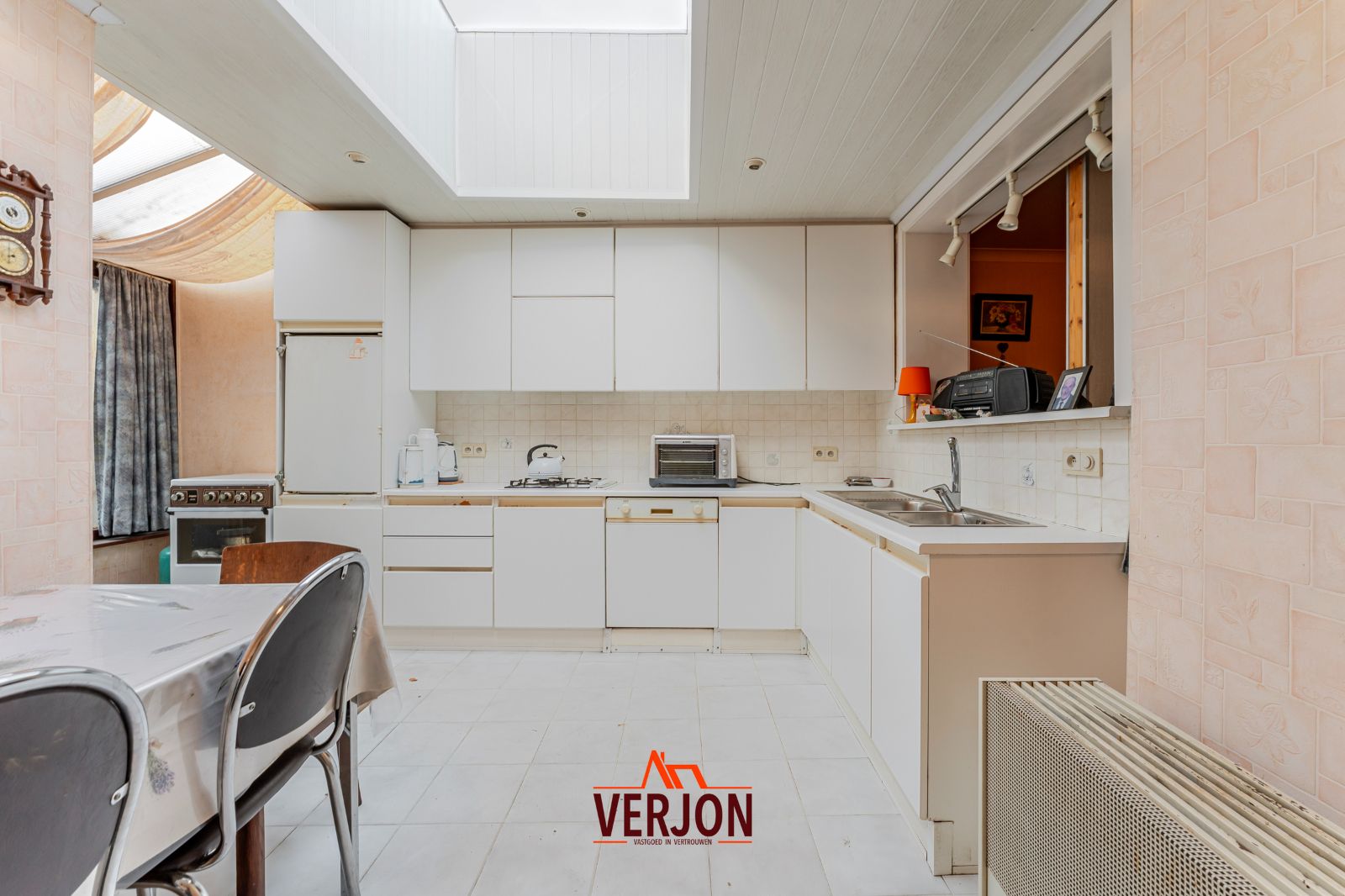 Charmante woning met ruime tuin te koop op het dorpsplein in Kachtem! foto 9