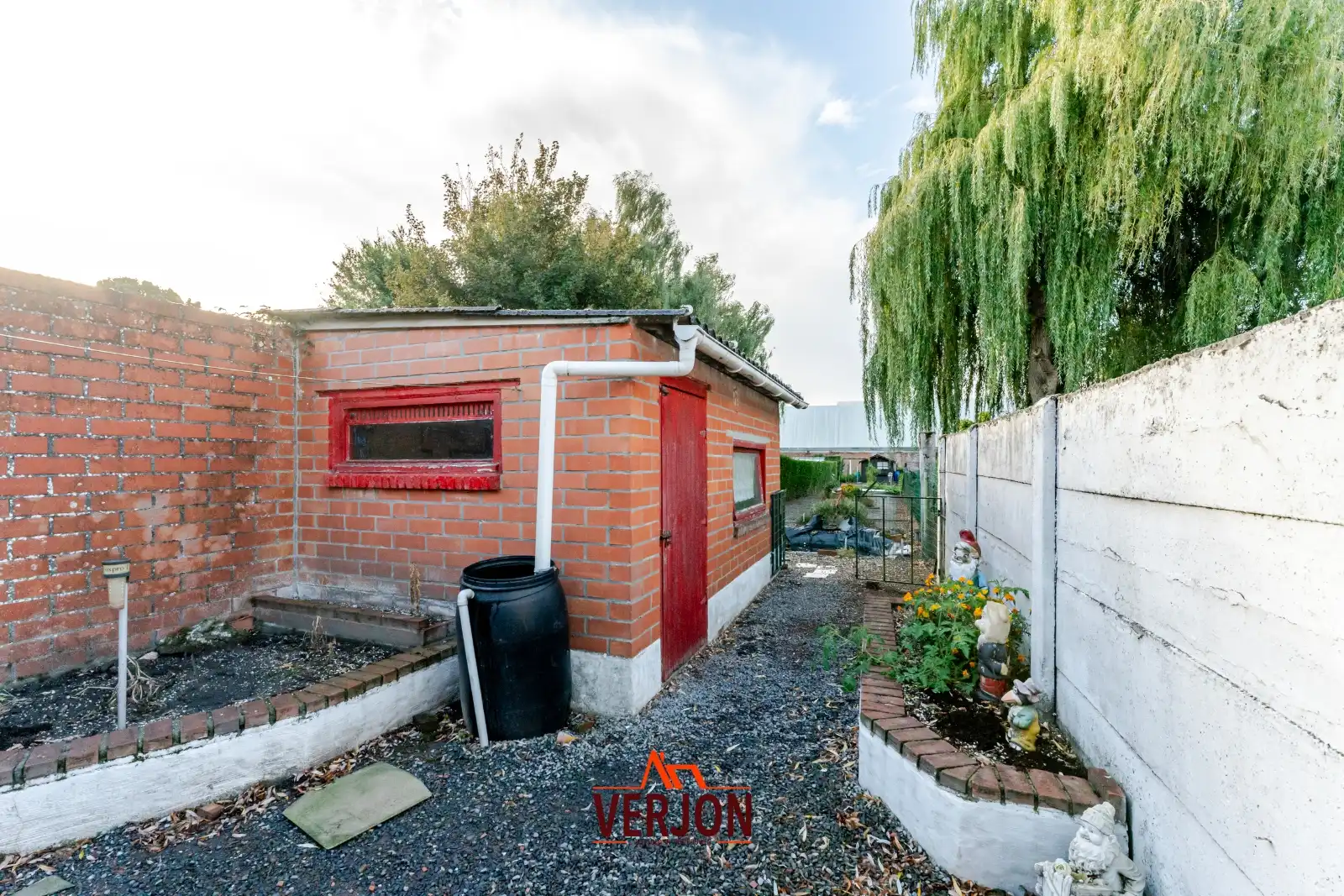 Charmante woning met ruime tuin te koop op het dorpsplein in Kachtem! foto 16