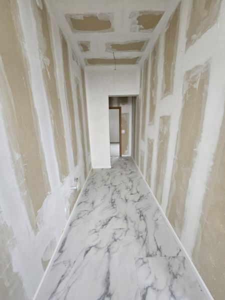 Opbrengstpand: 3 gerenoveerde woningen in halfopen en gesloten bebouwing foto 15