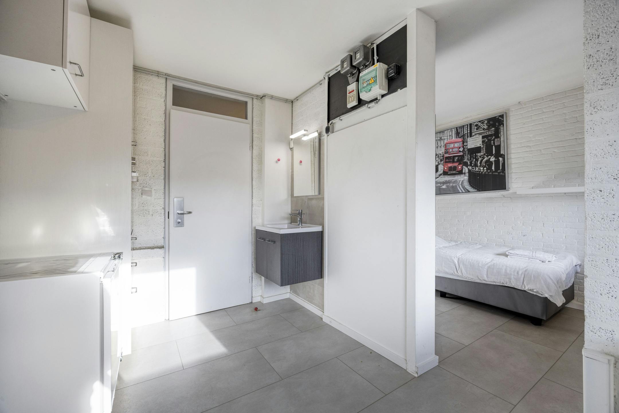 Opbrengsteigendom met 9 studentenkamers en duplex-appartement te Hasselt foto 13