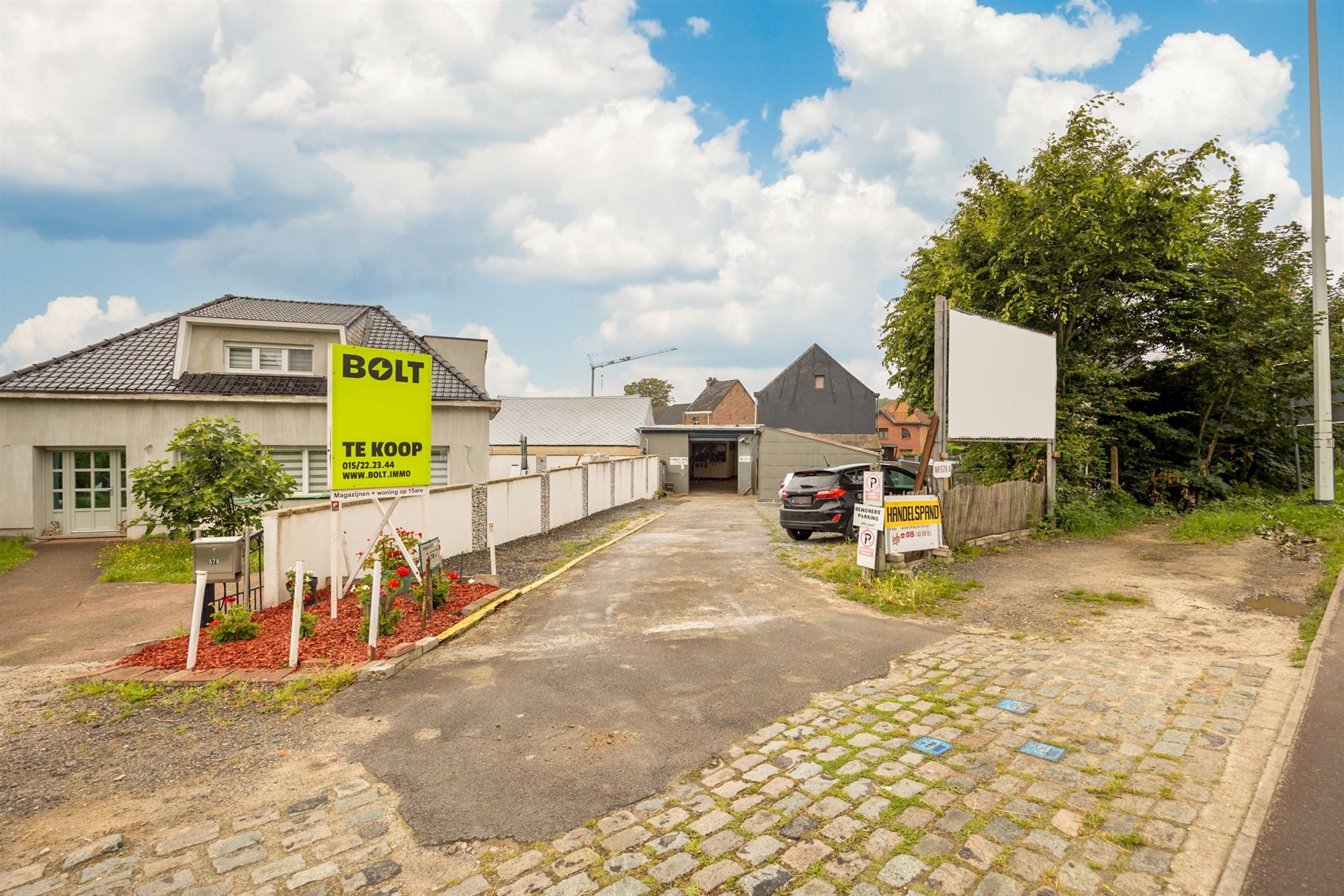 Opbrengsteigendom met magazijnen en woning te Muizen foto 1