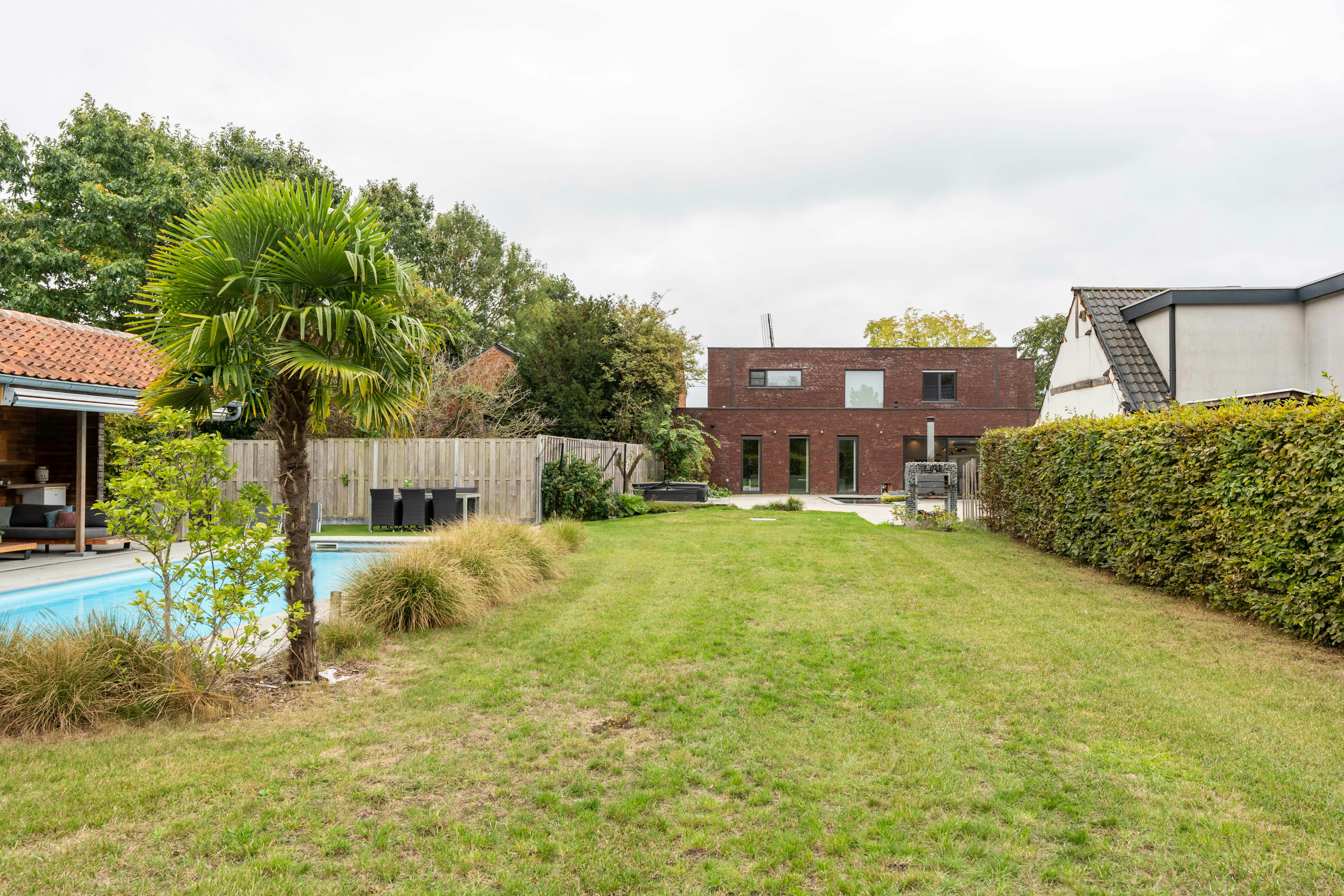 Moderne villa met zwembad en atelier te koop in Evergem foto 11