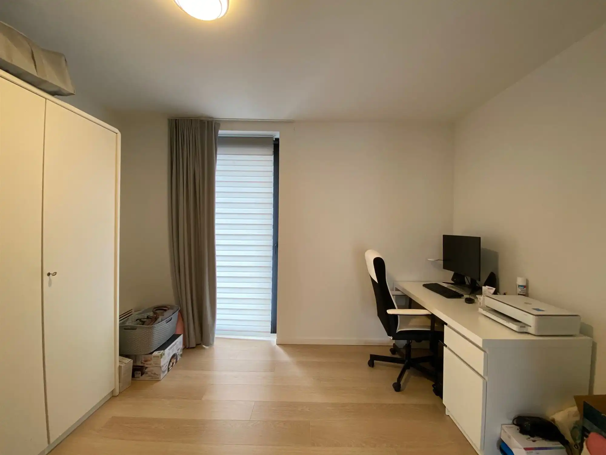 Knap en energiezuinig gelijkvloers appartement met 2-slpk, aangename tuin en een autostaanplaats foto 8