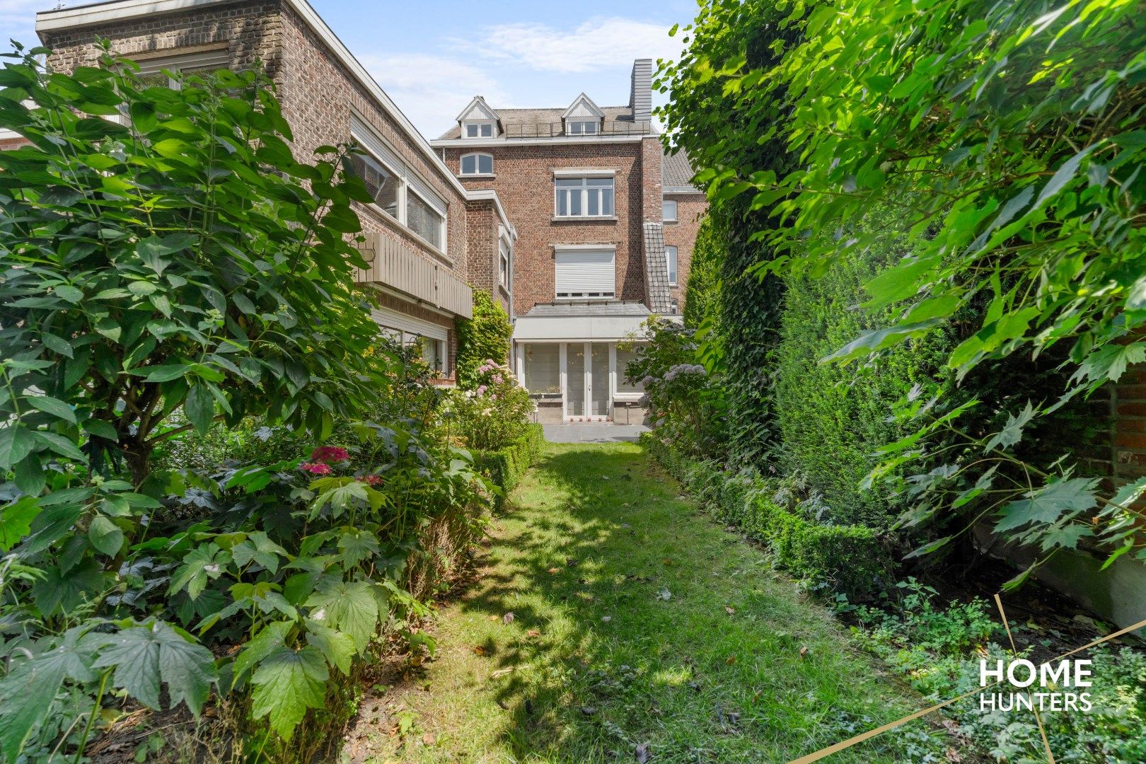 Statige herenwoning met 8 slaapkamers, ruime garage, praktijkruimte en fenomenale stadstuin foto 37