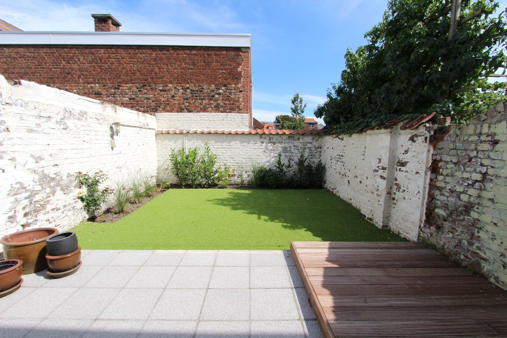 KNAP GERENOVEERDE WONING MET STADSTUIN foto 7