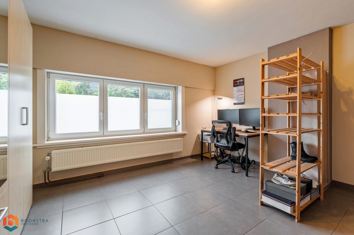 Verzorgde woning met 2 slpkrs, leuke tuin en garage foto 13