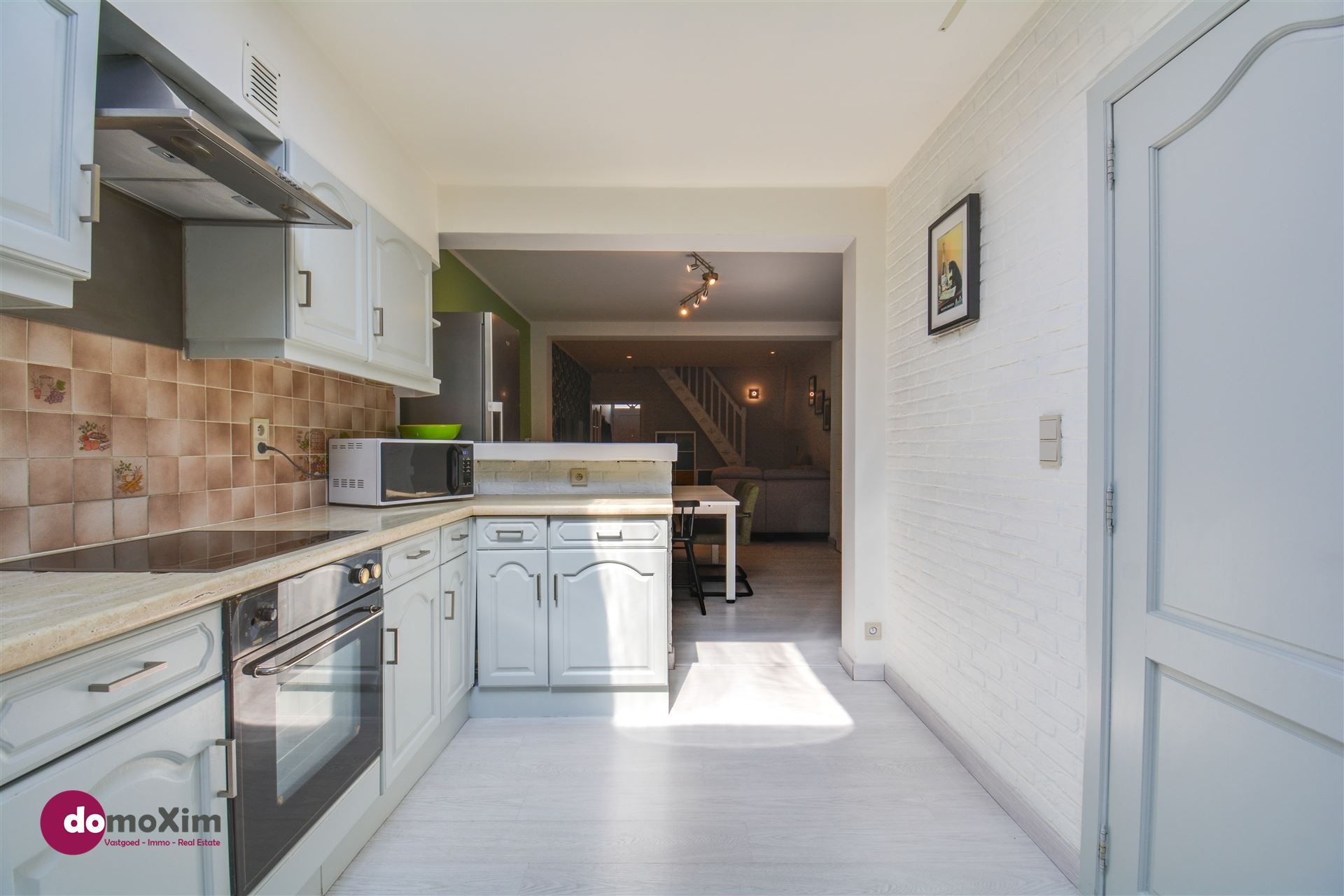 Verrassend ruime & stijlvol gerenoveerde rijwoning in hartje Muizen foto 7