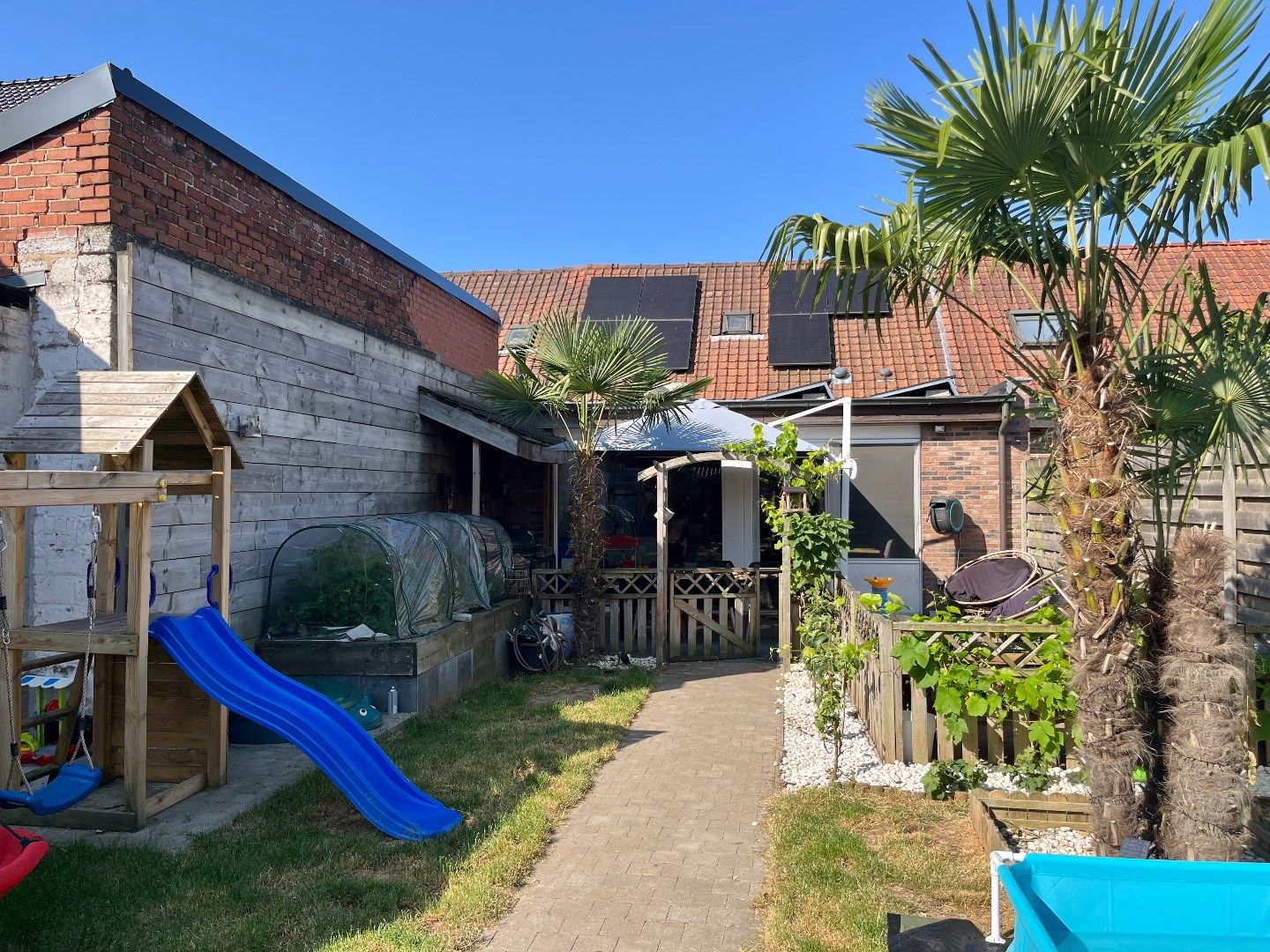 Instapklare woning te koop in Kuurne met zonnepanelen en aangename tuin. foto 20