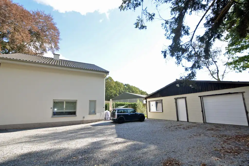 Vrijstaande, energiezuinige woning met 4 slpk en garage op een perceel van 25 a. foto 4