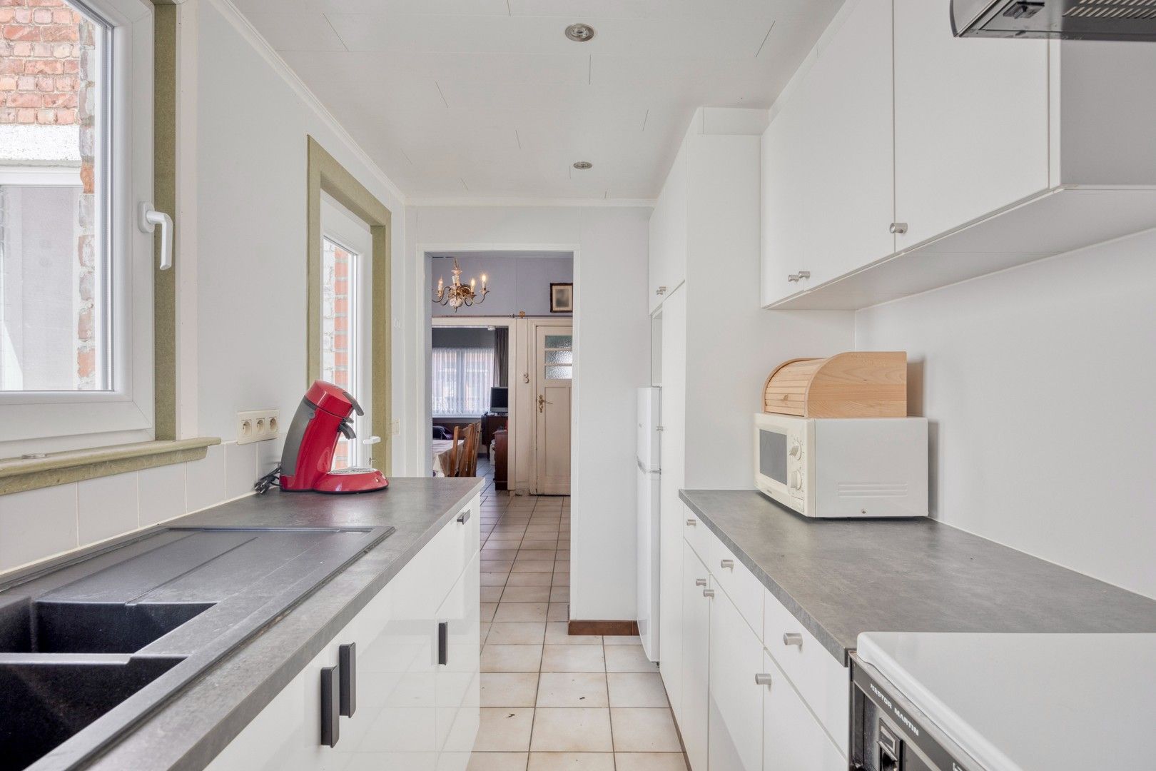 Op te knappen woning met oprit en tuin nabij de Gentbrugse Meersen foto 13