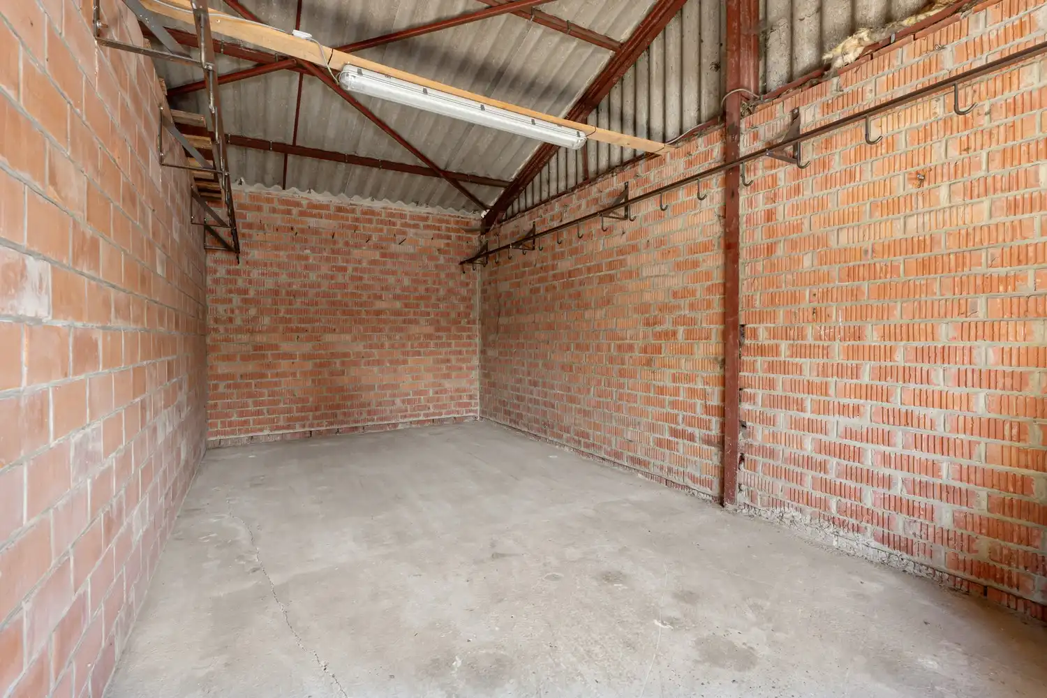 Commercieel pand met ruime handelsruimte, loods én drie-slaapkamer appartement van 160 m² in Wezemaal ! foto 14