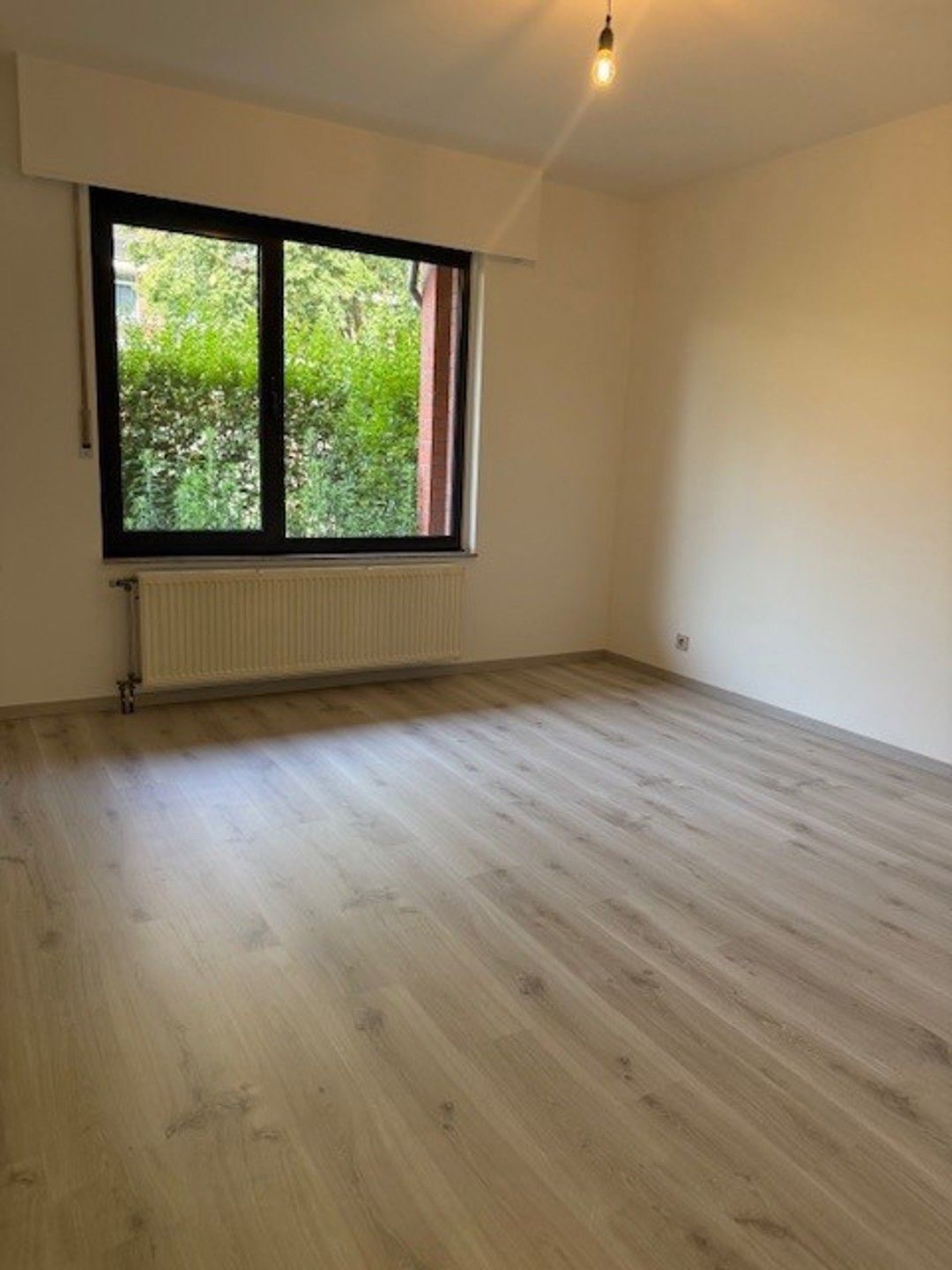 Deels gerenoveerd gelijkvloers appartement. foto 12