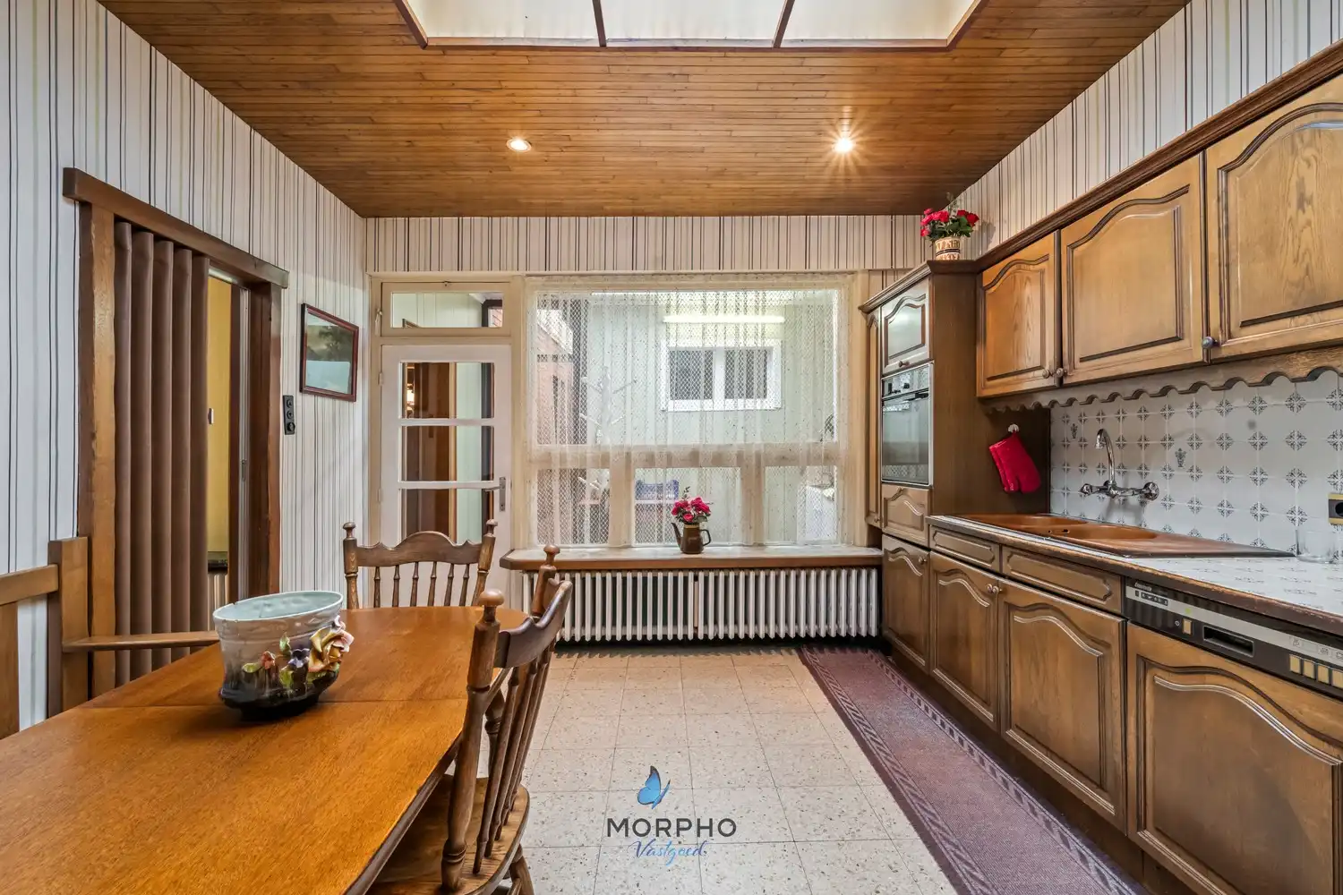 Te renoveren gezinswoning met karakter en potentieel in hartje Ruddervoorde foto 6