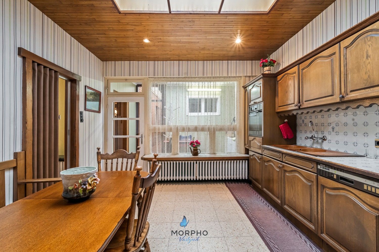 Te renoveren gezinswoning met karakter en potentieel in hartje Ruddervoorde foto 6