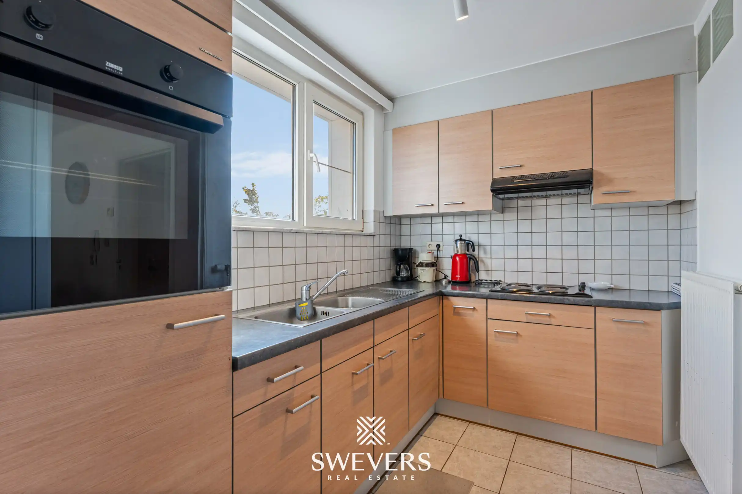 Instapklaar gelijkvloers 3-slaapkamerappartement met autostaanplaats en kelderberging nabij Hasselt-centrum foto 11