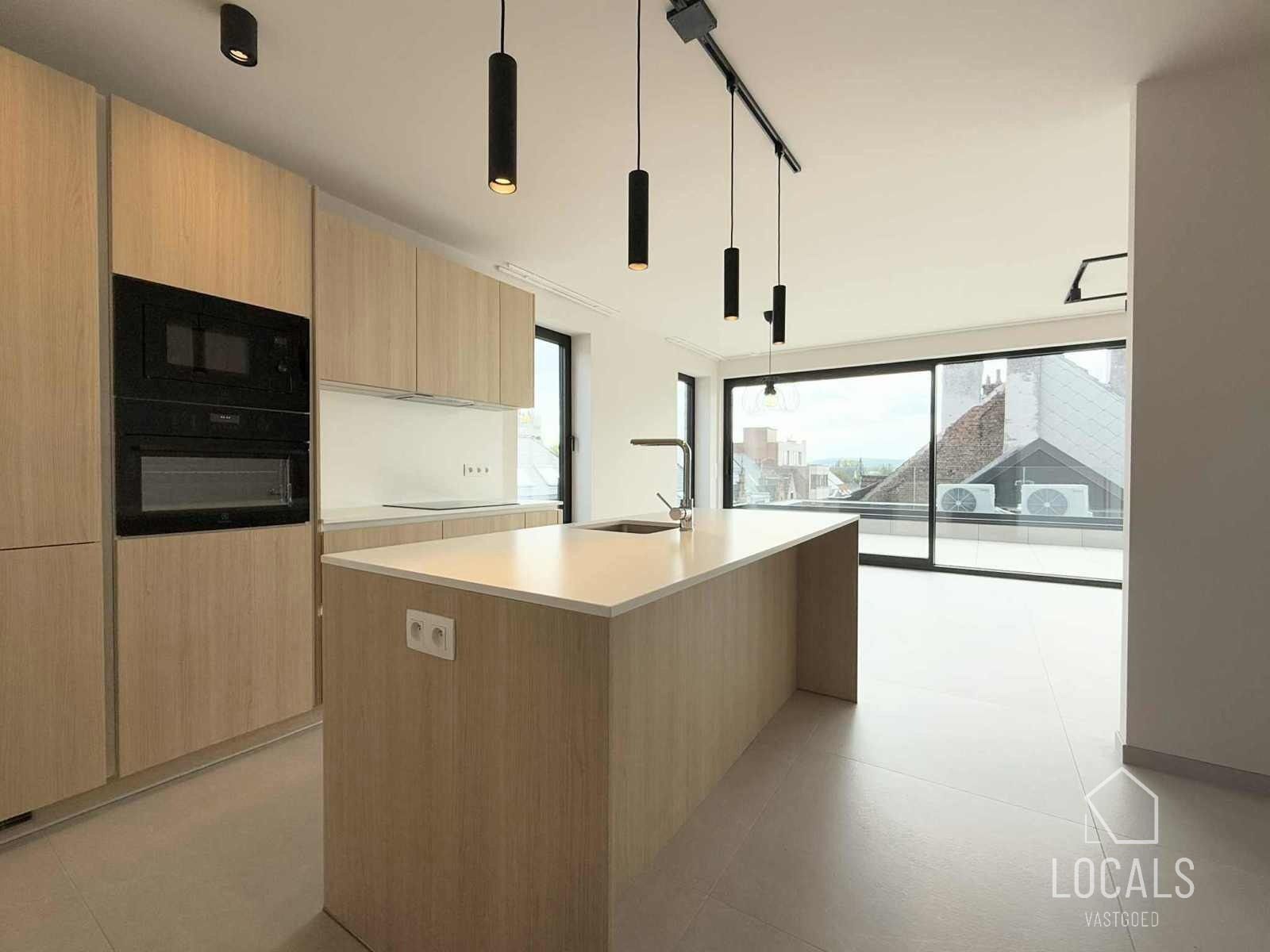 Luxueus energiezuinig nieuwbouwappartement in hartje Ninove foto {{pictureIndex}}