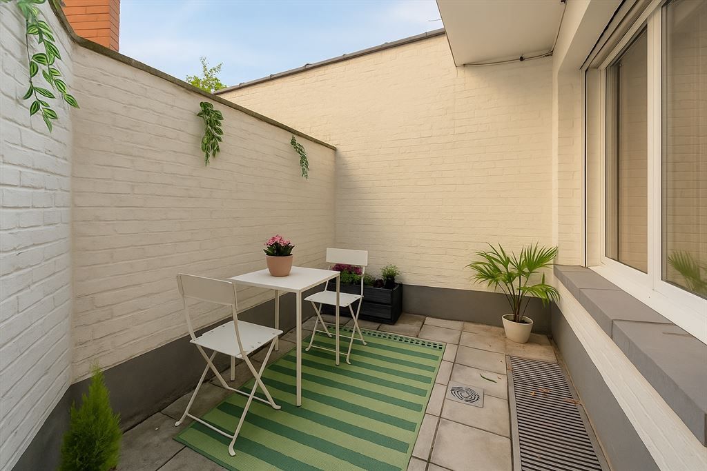 Instapklaar gelijkvloersappartement met stadskoer foto 7