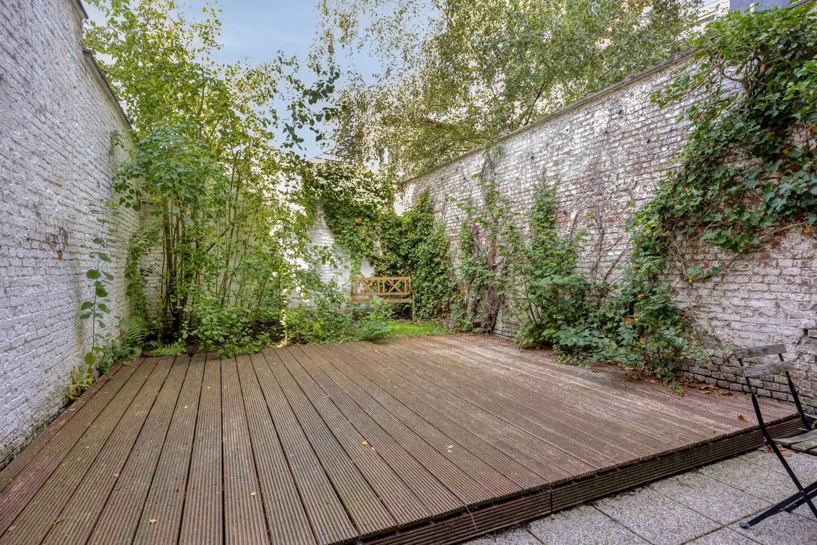 Instapklaar 1-slpk appartement met tuin foto 12