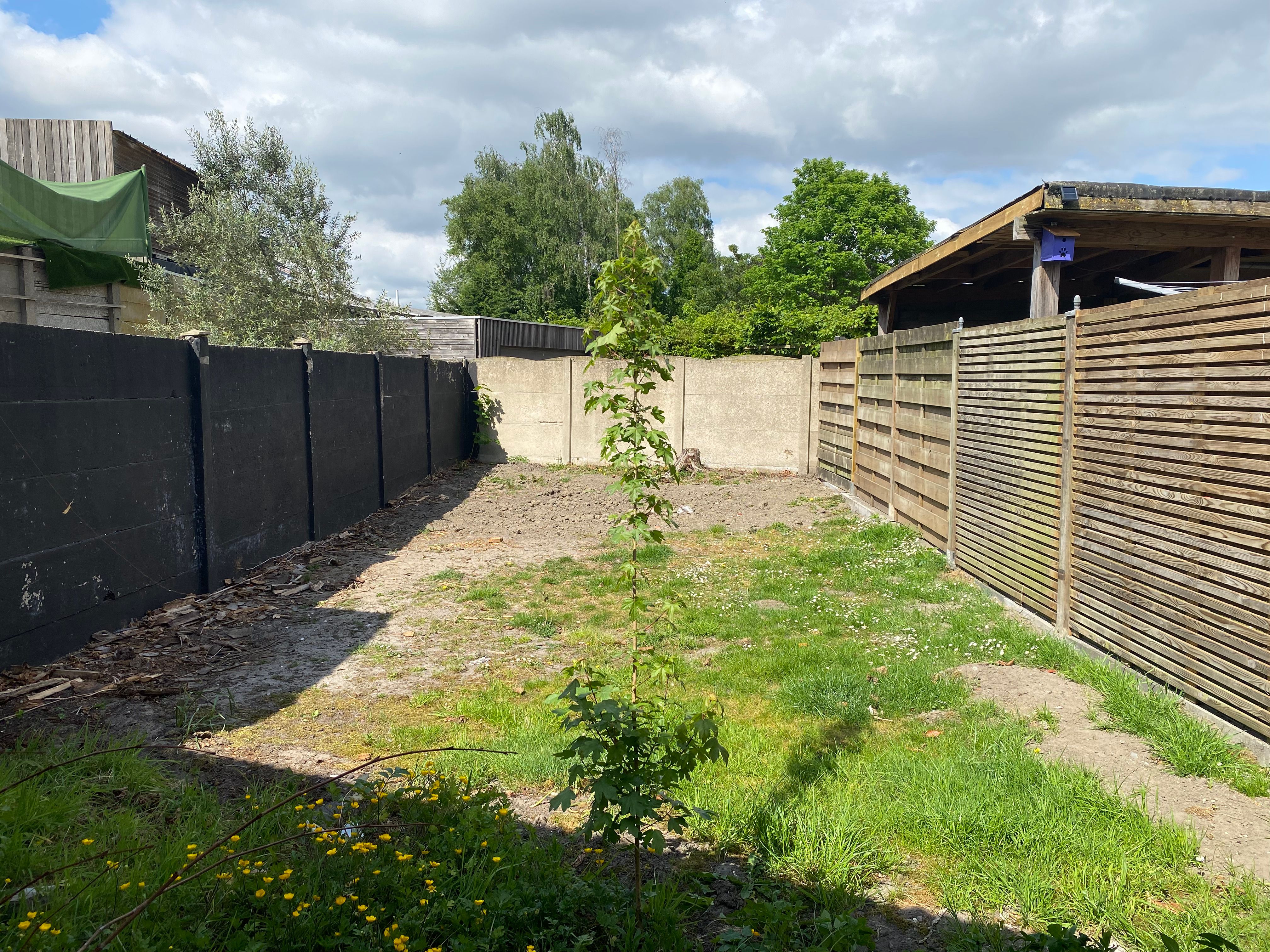 Charmante rijwoning te koop met tuin en veel potentieel foto 11
