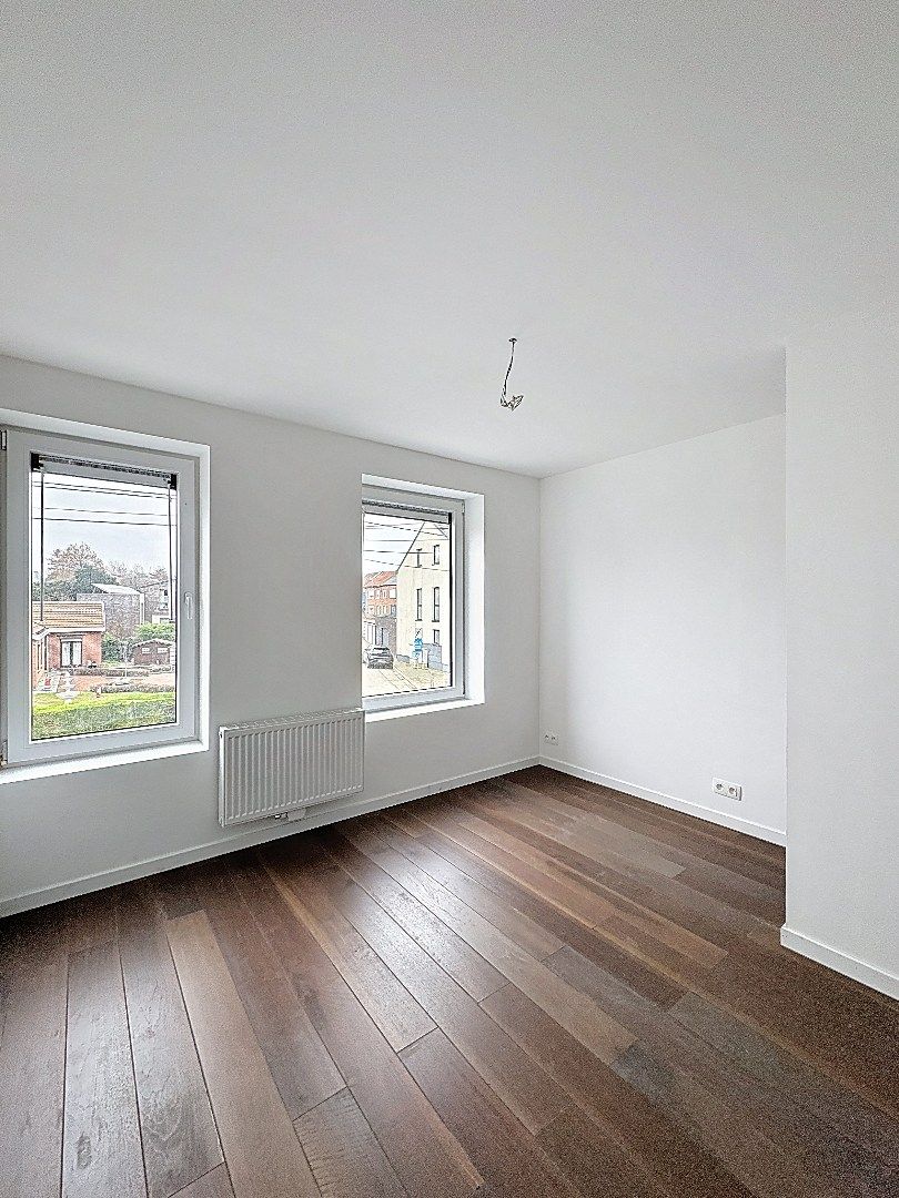 Elegant wonen in Tienen: gerenoveerde rijwoning met 3 slaapkamers en zuidwestgerichte tuin. foto 13