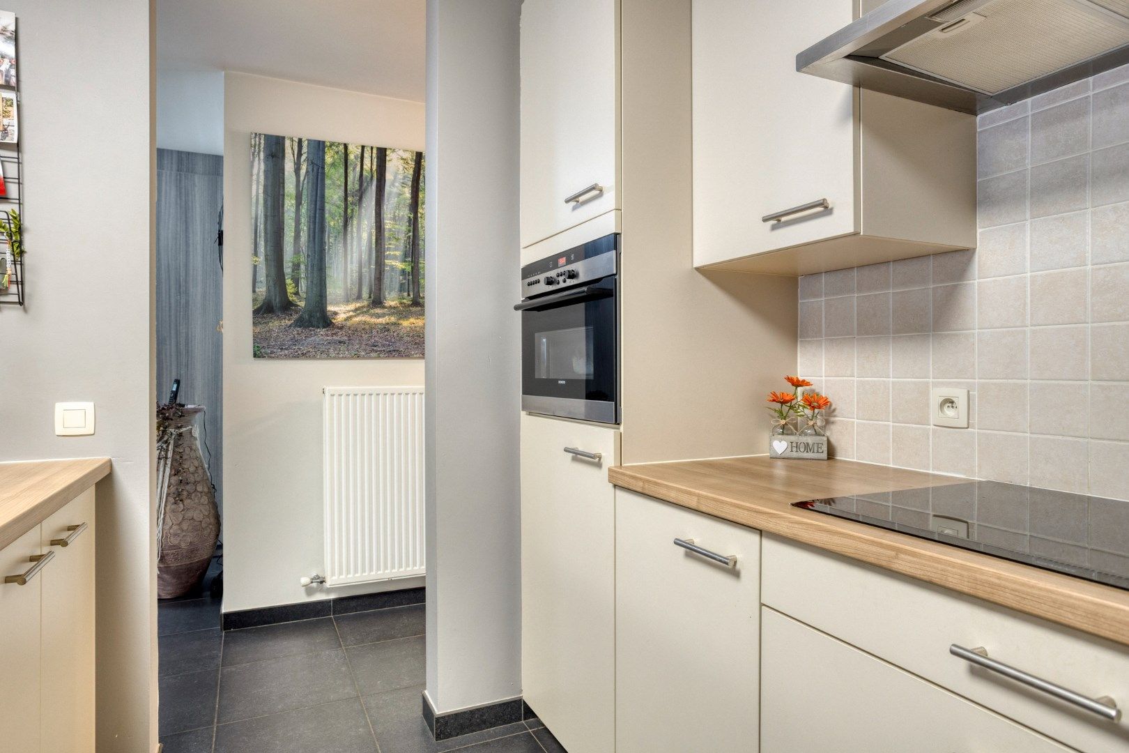 Verzorgd gelijkvloers appartement met tuin vlakbij het centrum foto 12