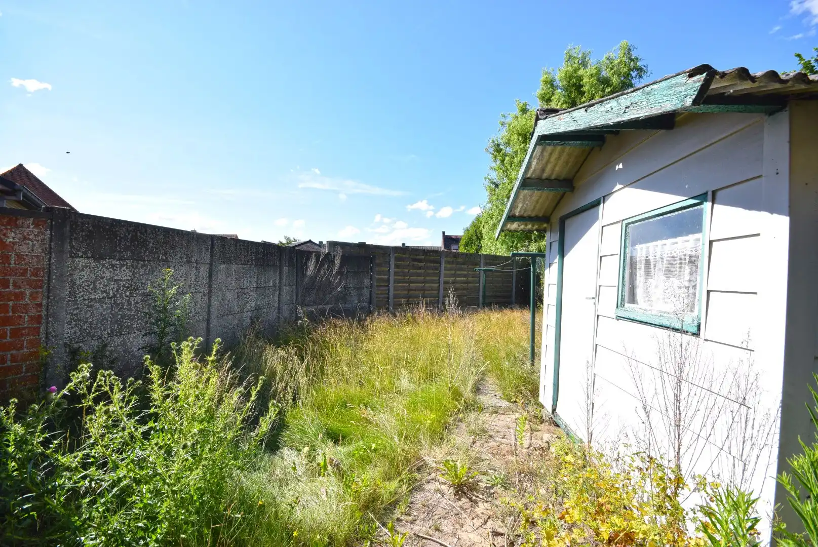 Te renoveren arbeiderswoning met tuin nabij het centrum van Roeselare foto 13
