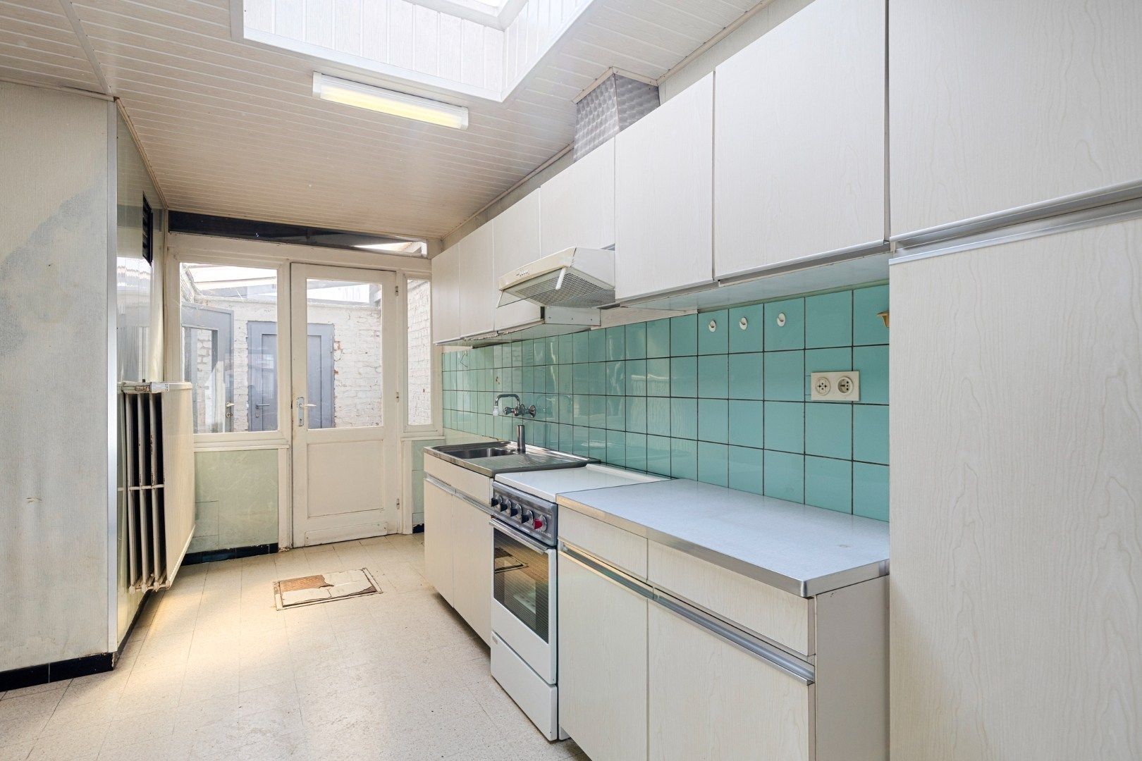 Te renoveren woning met 4 slaapkamers, garage en tuin in Kessel-Lo – EPC 906 kWh/m² - bewoonbare opp. 163 m² foto 7