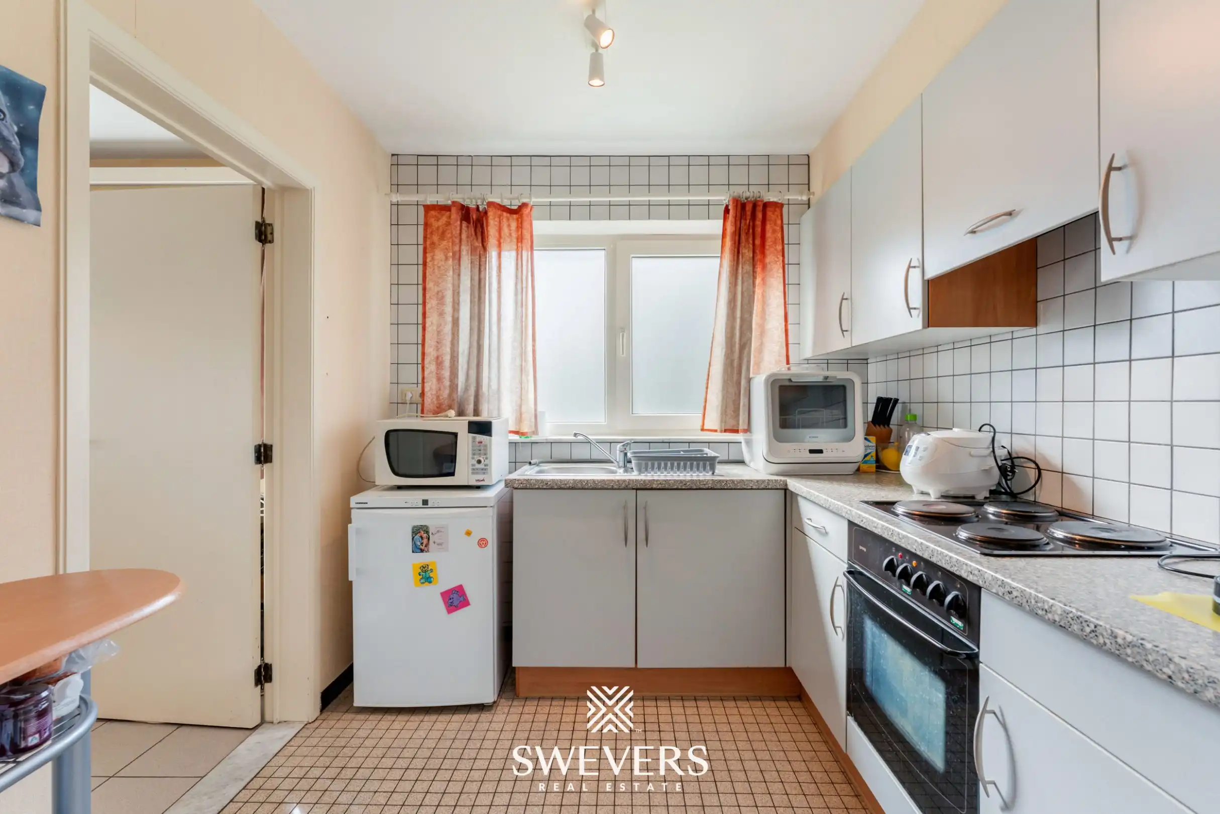 Ruim gelijkvloers 3-slaapkamerappartement inclusief autostaanplaats en kelderberging nabij Hasselt-centrum foto 12