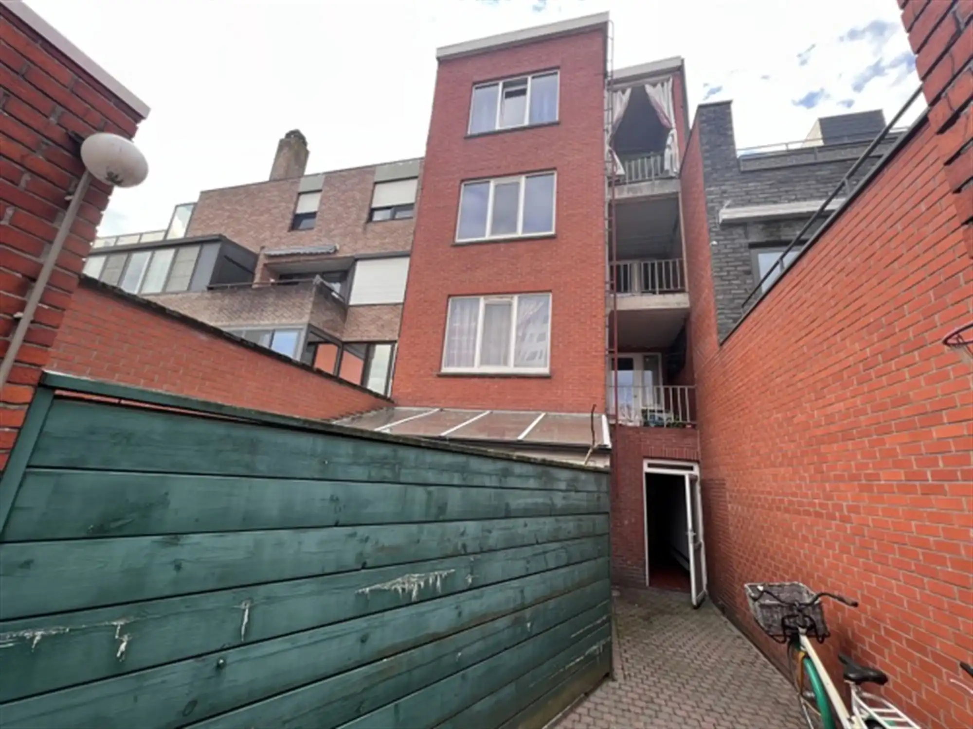 Opbrengsteigendom met 4 appartementen en tuin foto 15