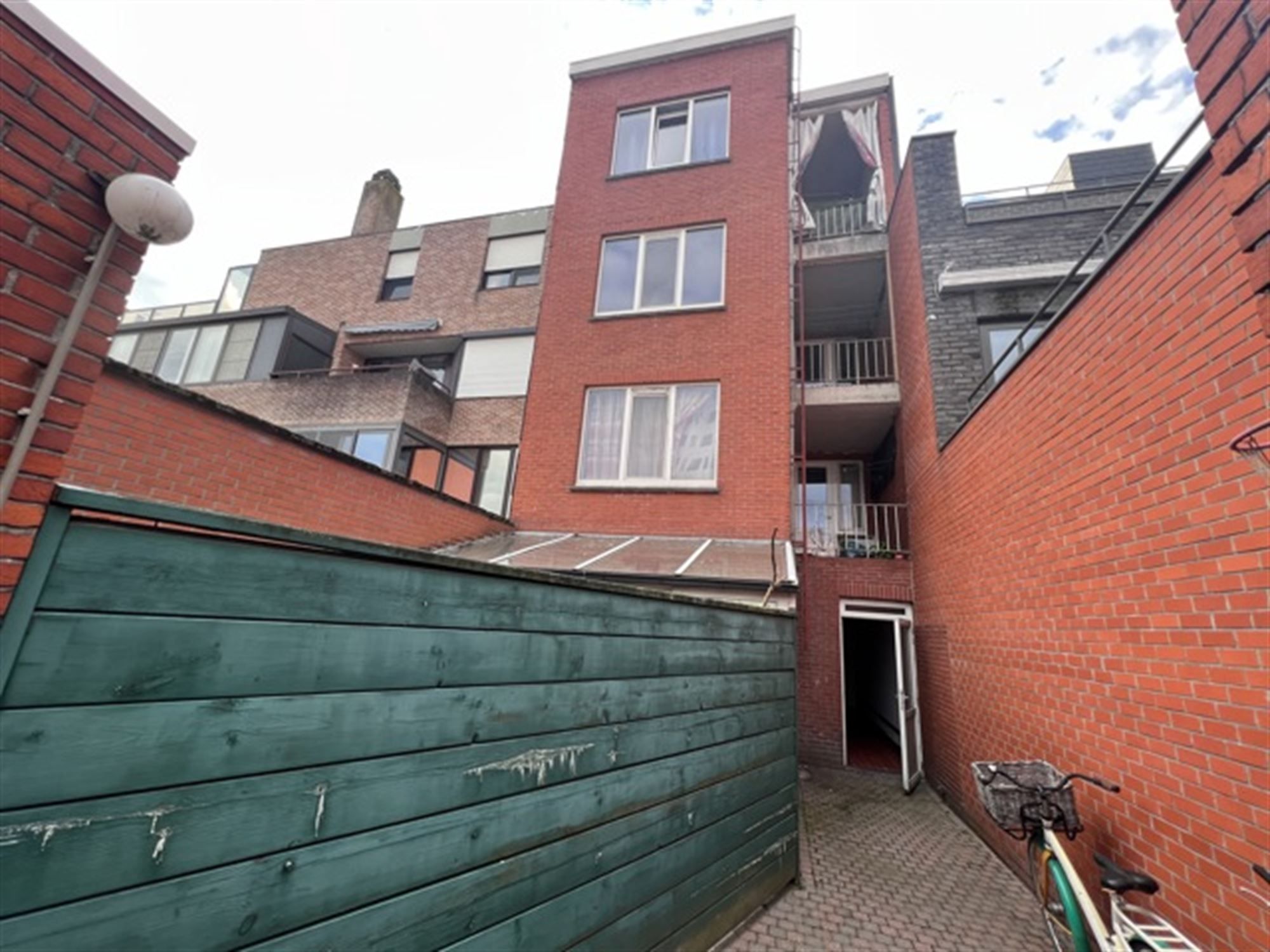 Opbrengsteigendom met 4 appartementen en tuin foto 15