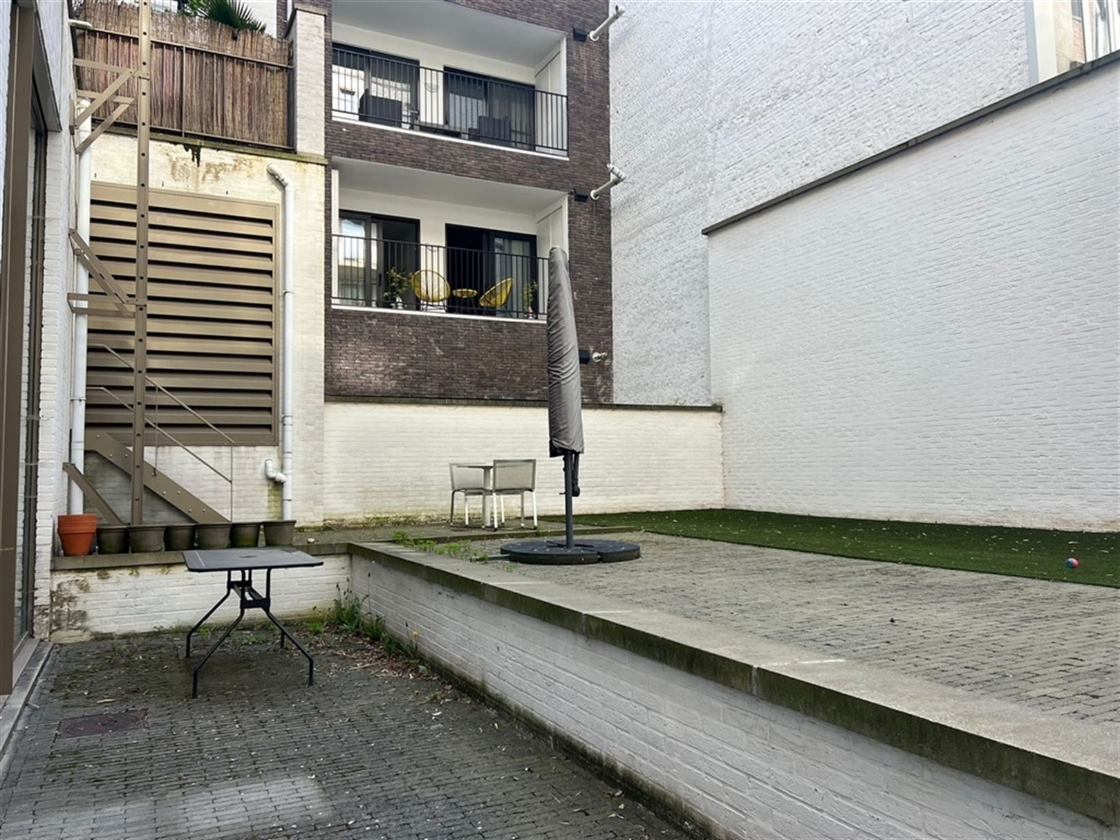 Geliijkvloerse kantoorruimte met hoge plafonds op het Eilandje foto 11