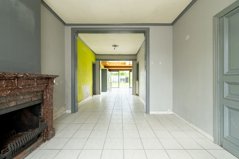 Ruime en veelzijdige rijwoning met garage achteraan en aparte ingang foto 3