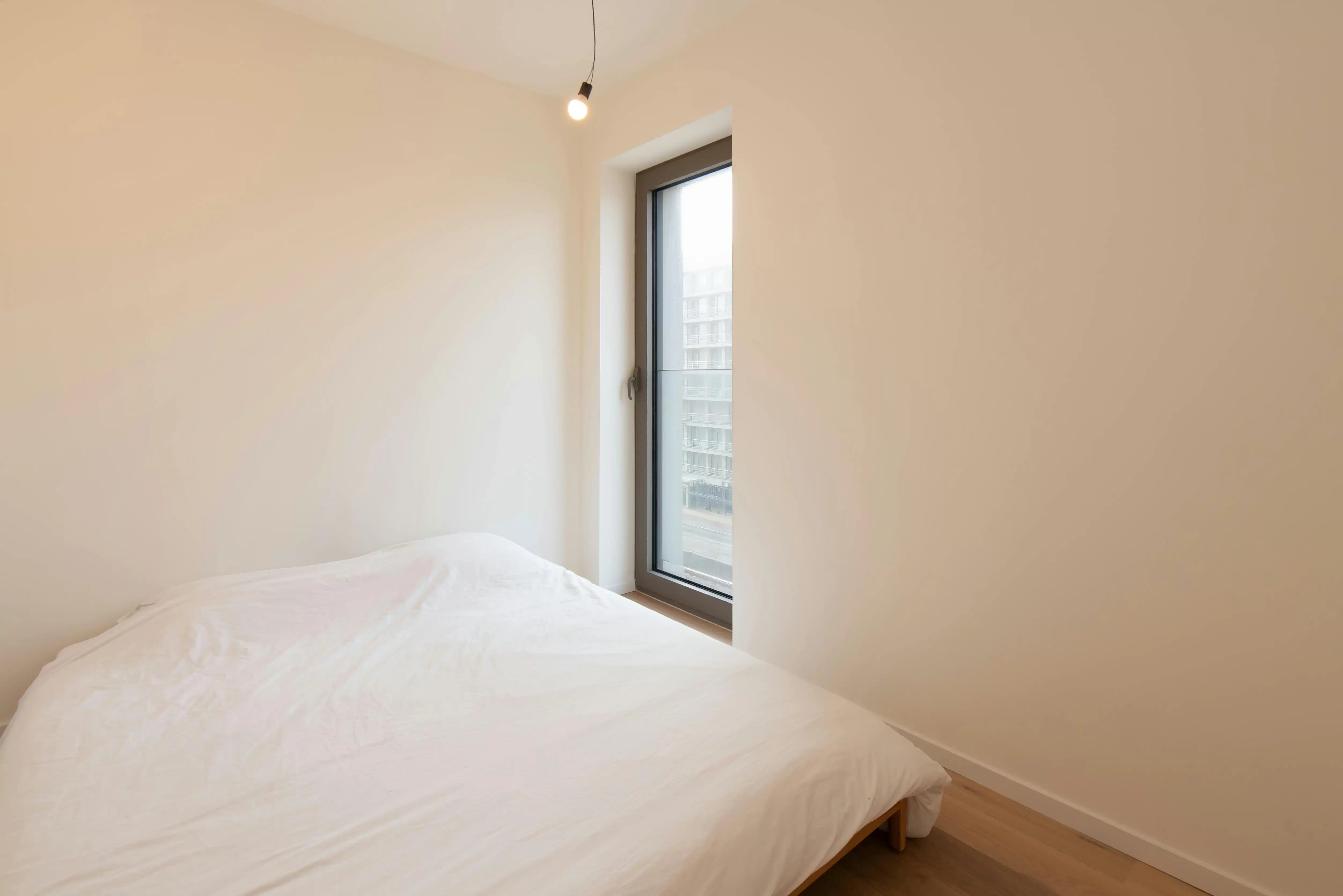 Lichtrijk nieuwbouw 1-slaapkamer appartement te Oostende foto 12