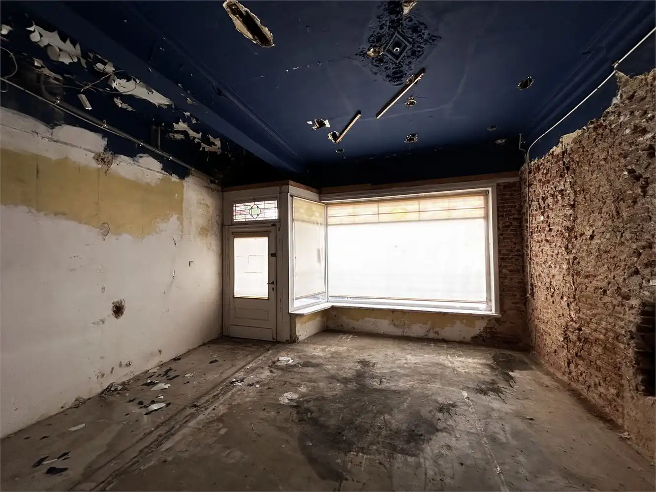 Te renoveren handelshuis met woonst foto 6