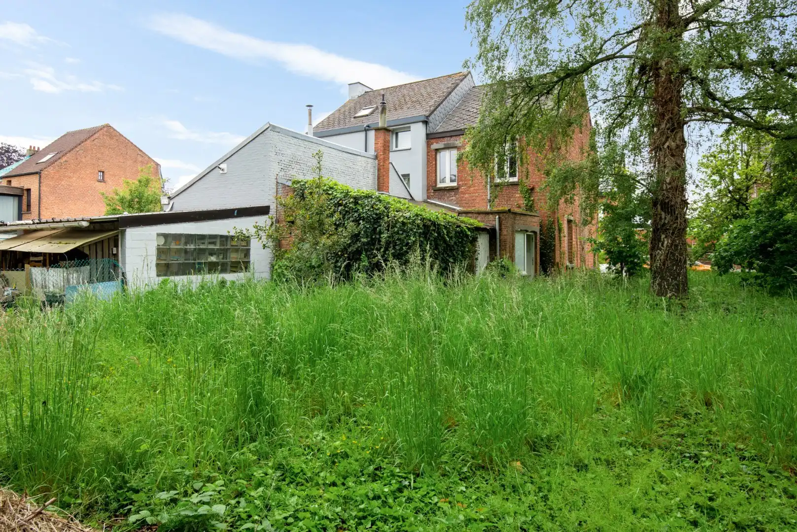 Te renoveren woning met bouwgrond en veel potentieel op rustige ligging in Puurs-Sint-Amands! foto 7