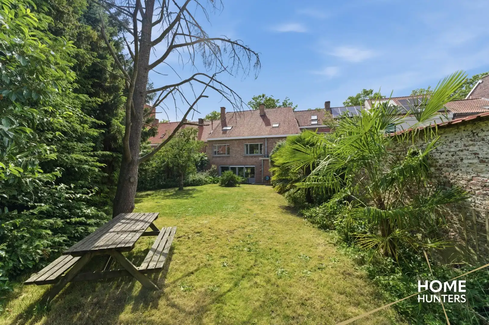 Statige stadswoning met uitzonderlijke volumes, garage en prachtige tuin in hartje Ieper foto 37