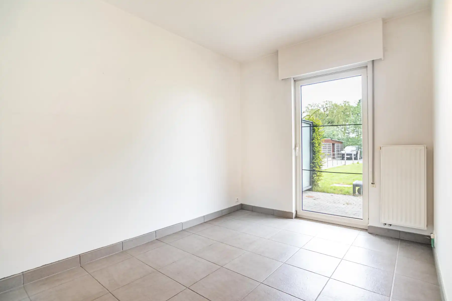 Instapklaar gelijkvloers appartement met privatieve tuin foto 18