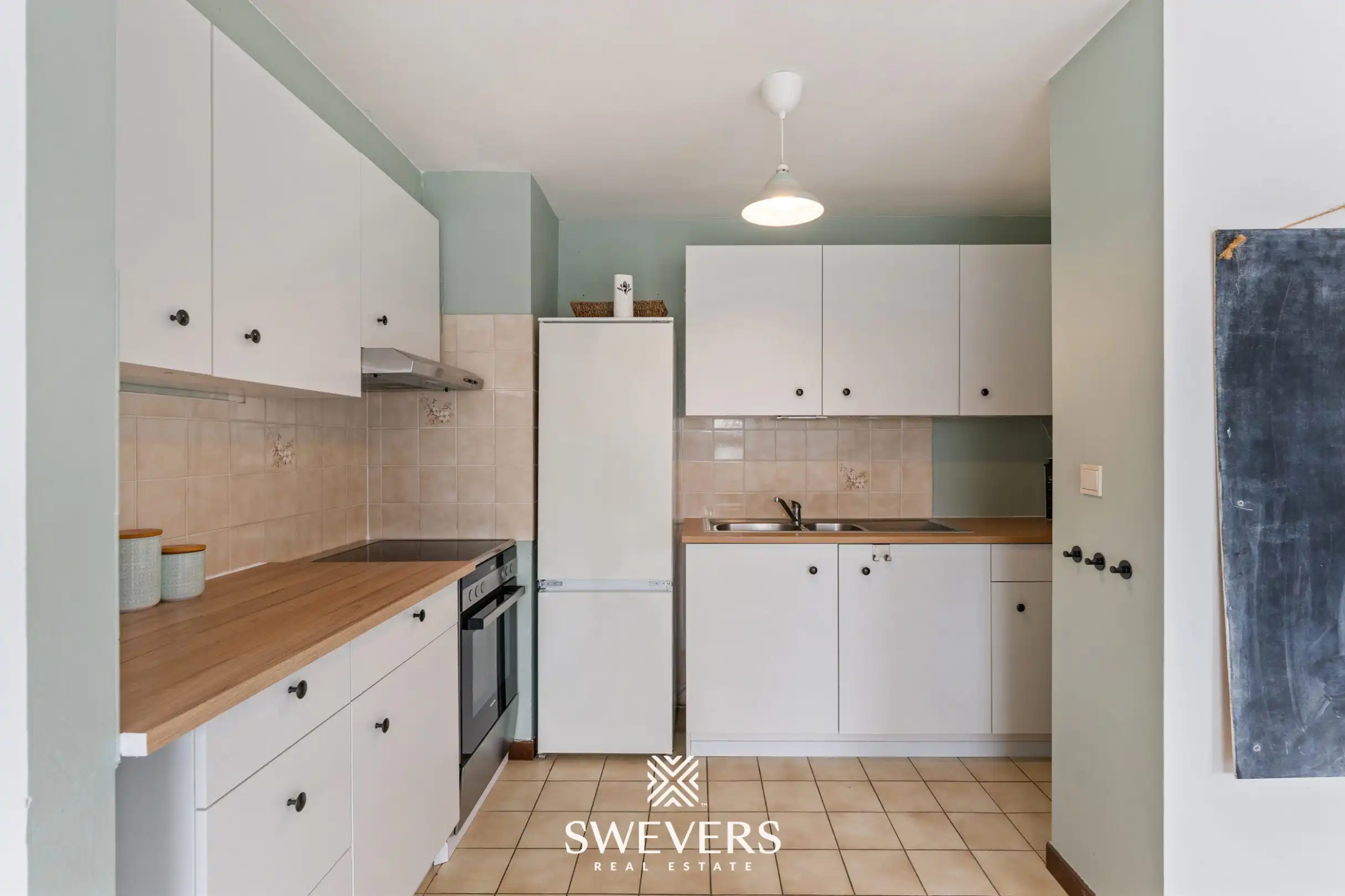 Instapklaar en lichtrijk 1-slaapkamerappartement op topligging in Houthalen centrum foto 10