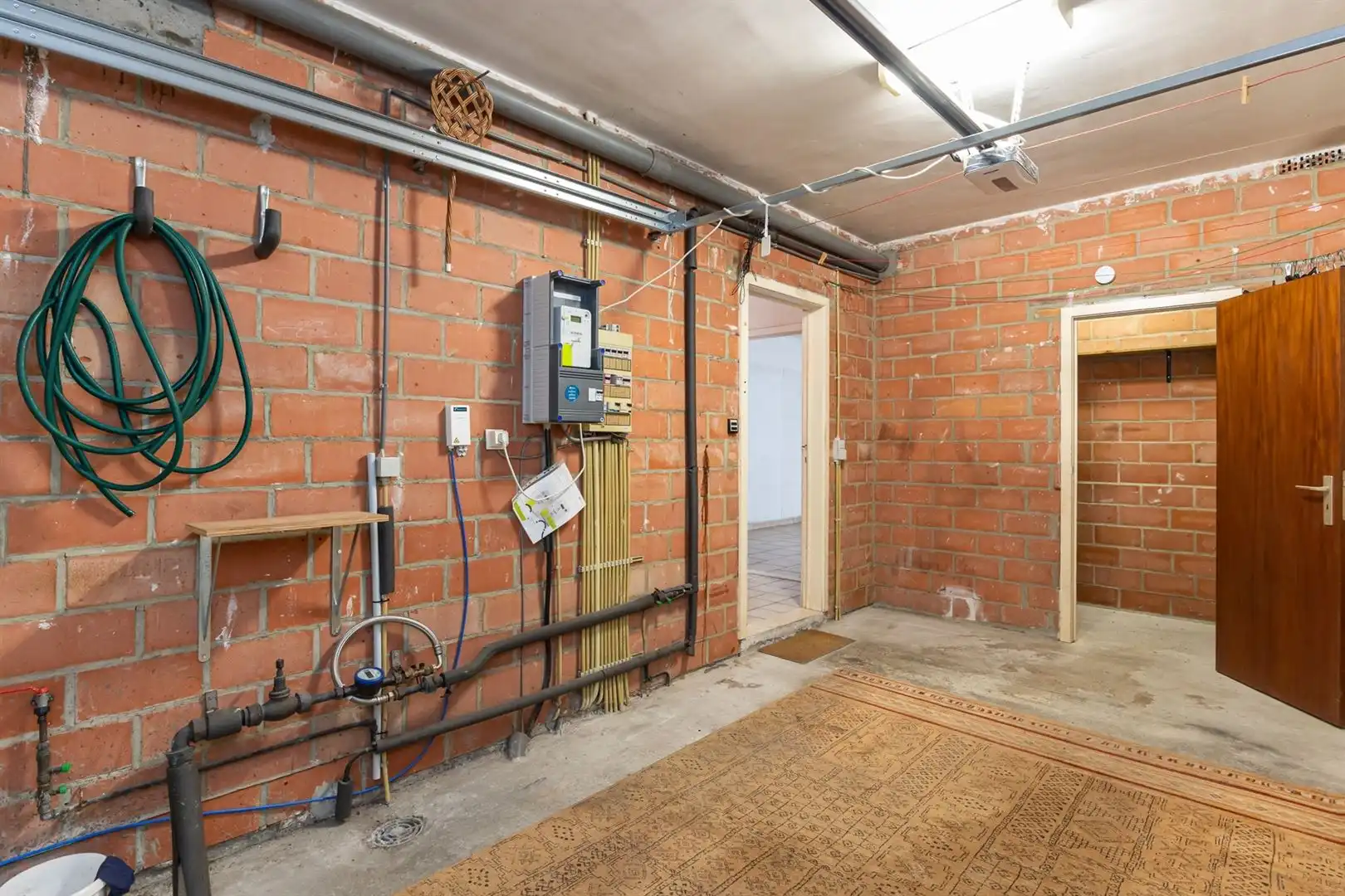 Te renoveren gezinswoning met tuin en garage in rustige centrumstraat foto 22