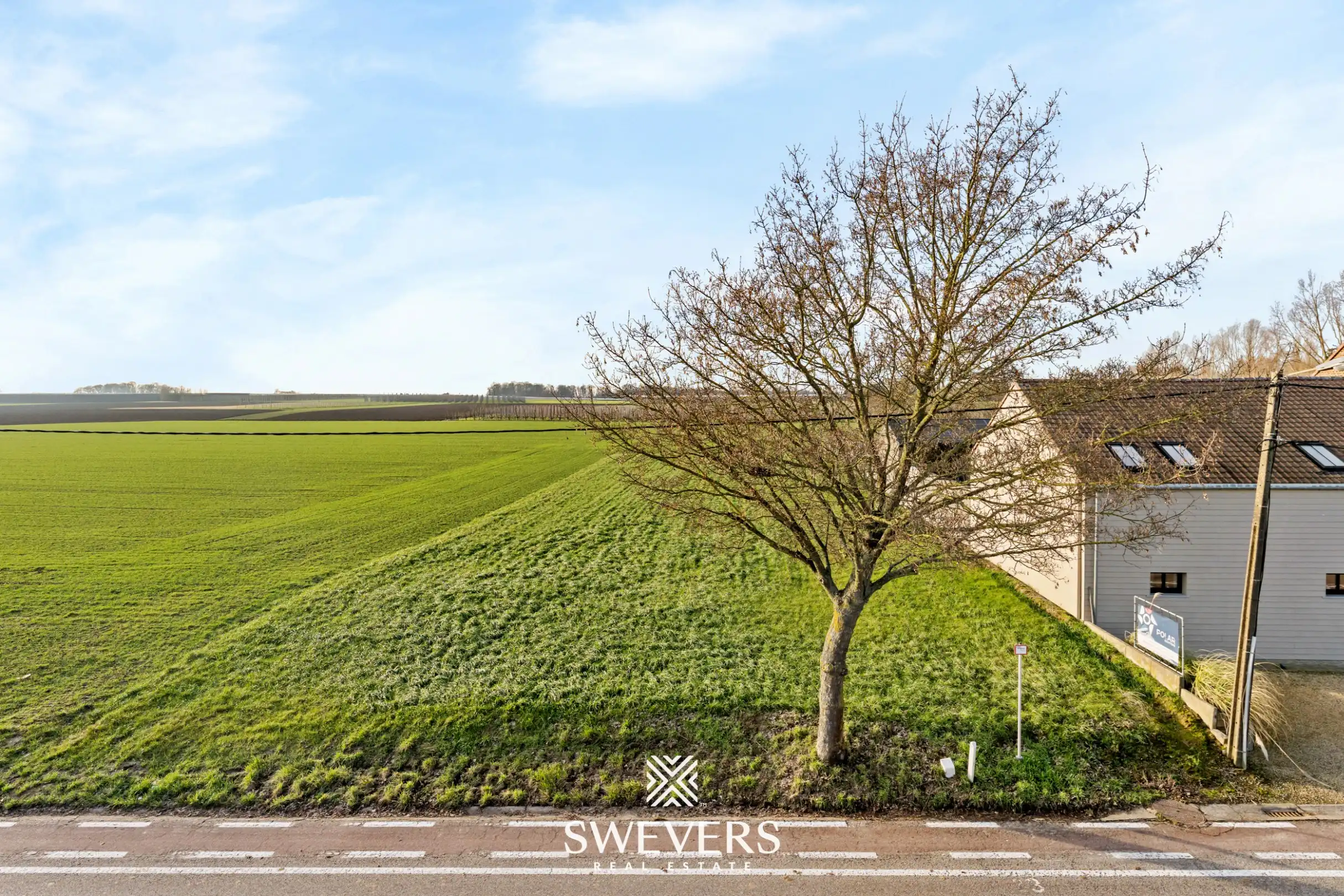 Bouwgrond van 13a97ca voor een halfopen bebouwing met mooi zicht op agrarisch gebied te Sint-Truiden foto {{pictureIndex}}