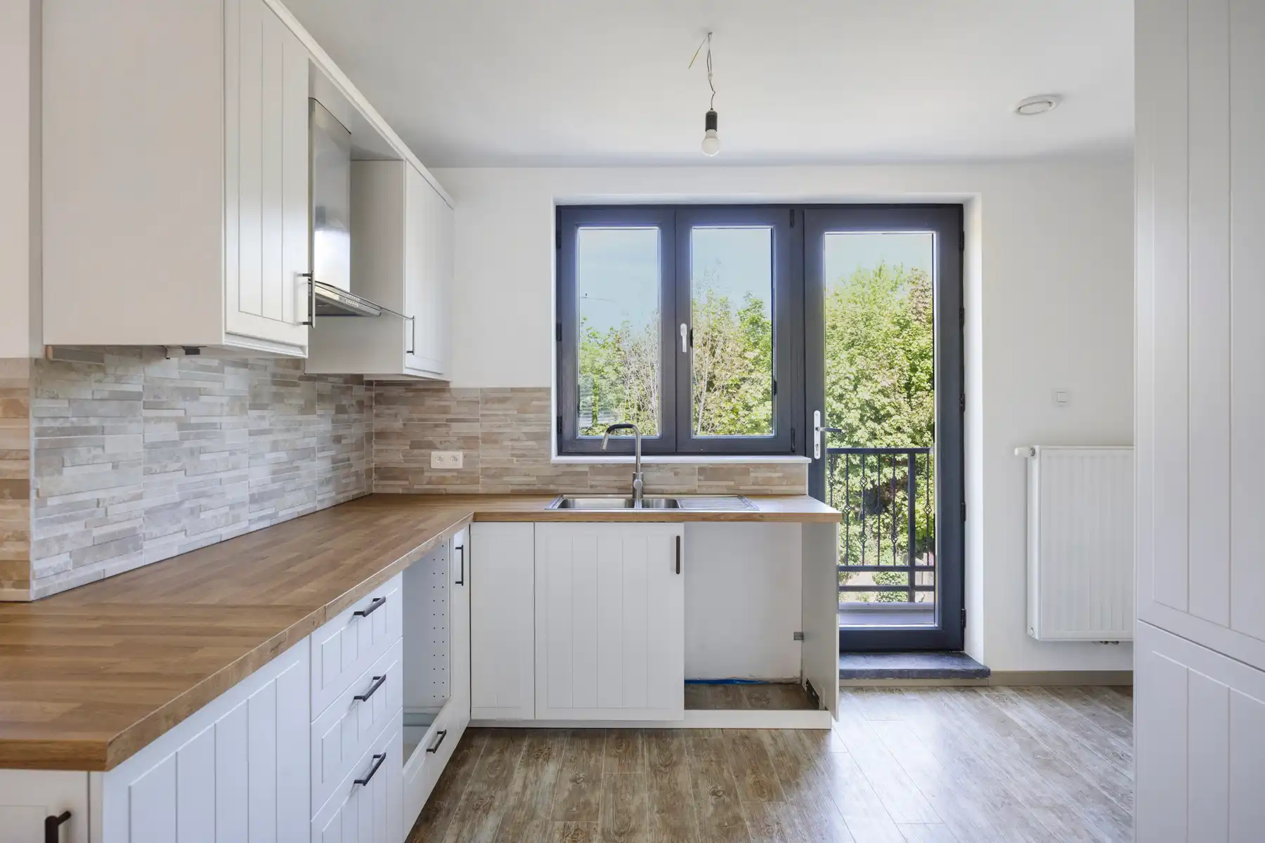 Nieuwbouw triplex met 4 slaap- en badkamers, tuin en parking foto 7