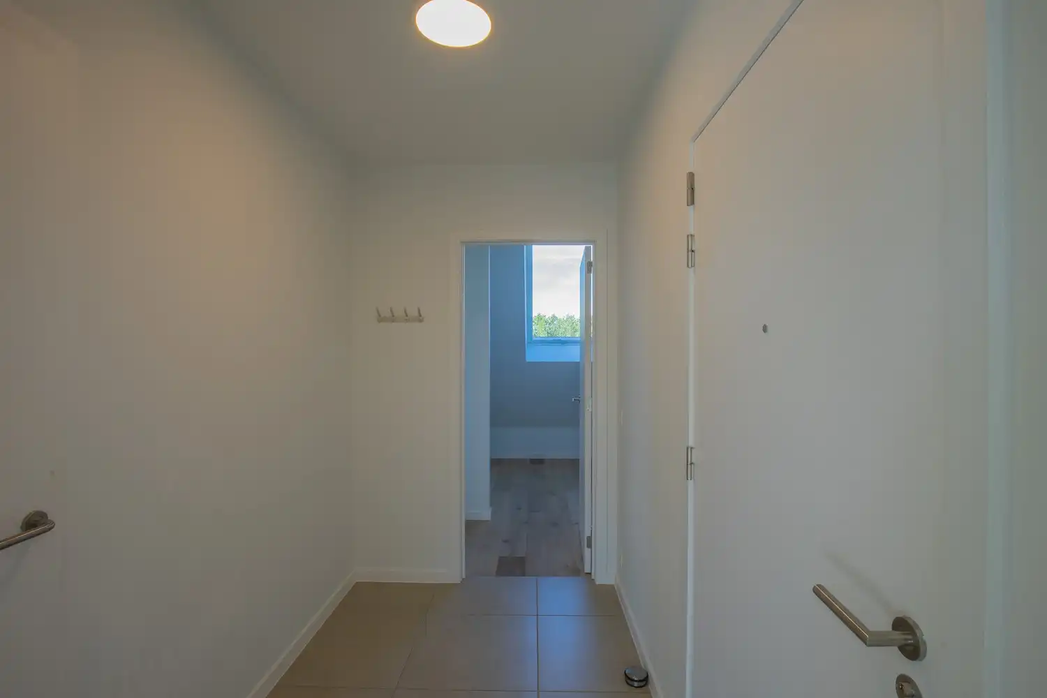 Energiezuinig dakappartement met 1 slaapkamer, aparte dressing/bureau, terras en ondergrondse staanplaats in Residentie Luster foto 11