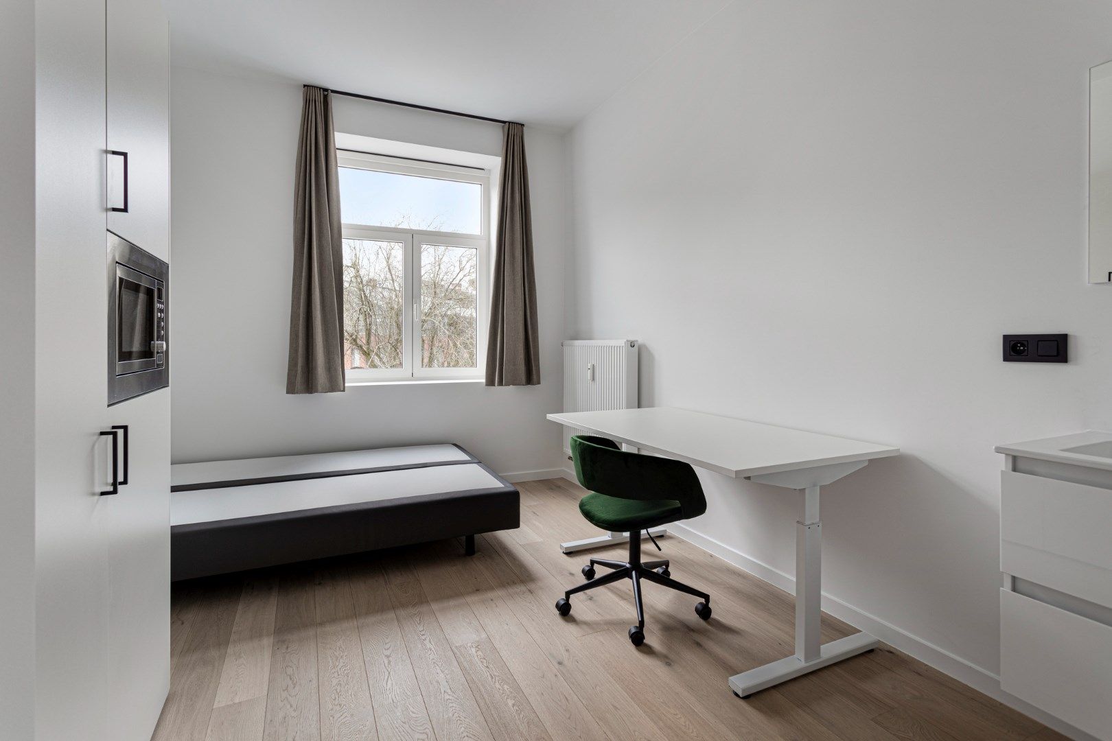 Volledig gerenoveerde studentenkamer in residentie met 29 studentenkamers met eigen sanitair in hartje Leuven  foto 11