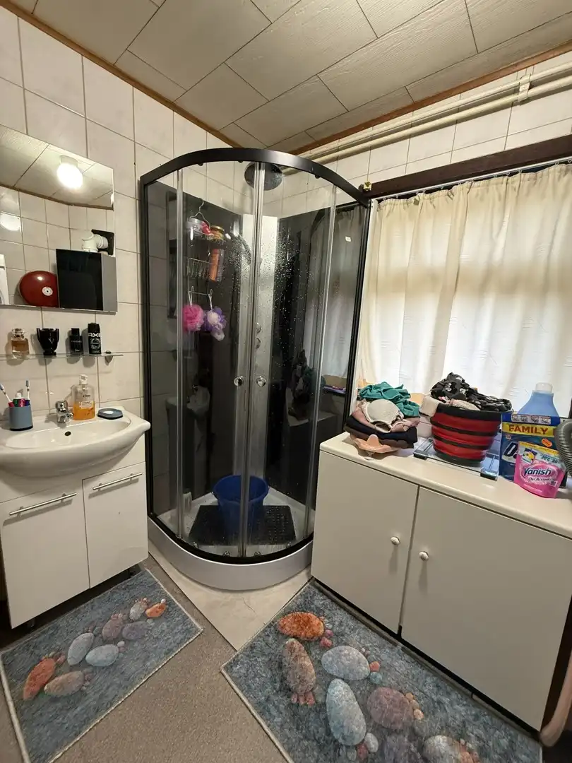 Opbrengsteigendom bestaande uit 2 halfopen woningen met garage en tuin te Hechtel. foto 28