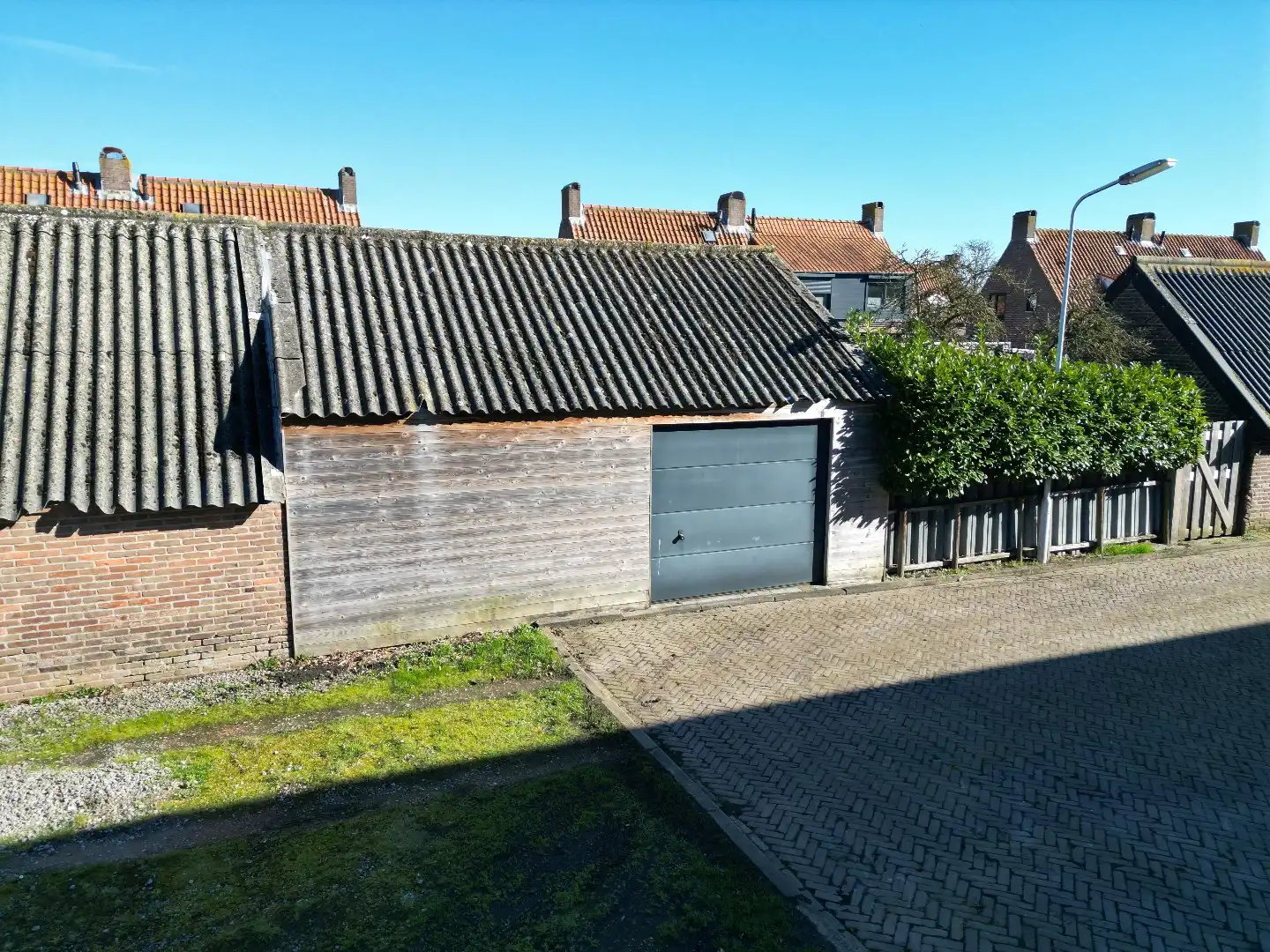 Instapklare twee-onder-een-kapwoning met uitbouw, luxe overkapping en zonnige tuin op het westen  foto 44