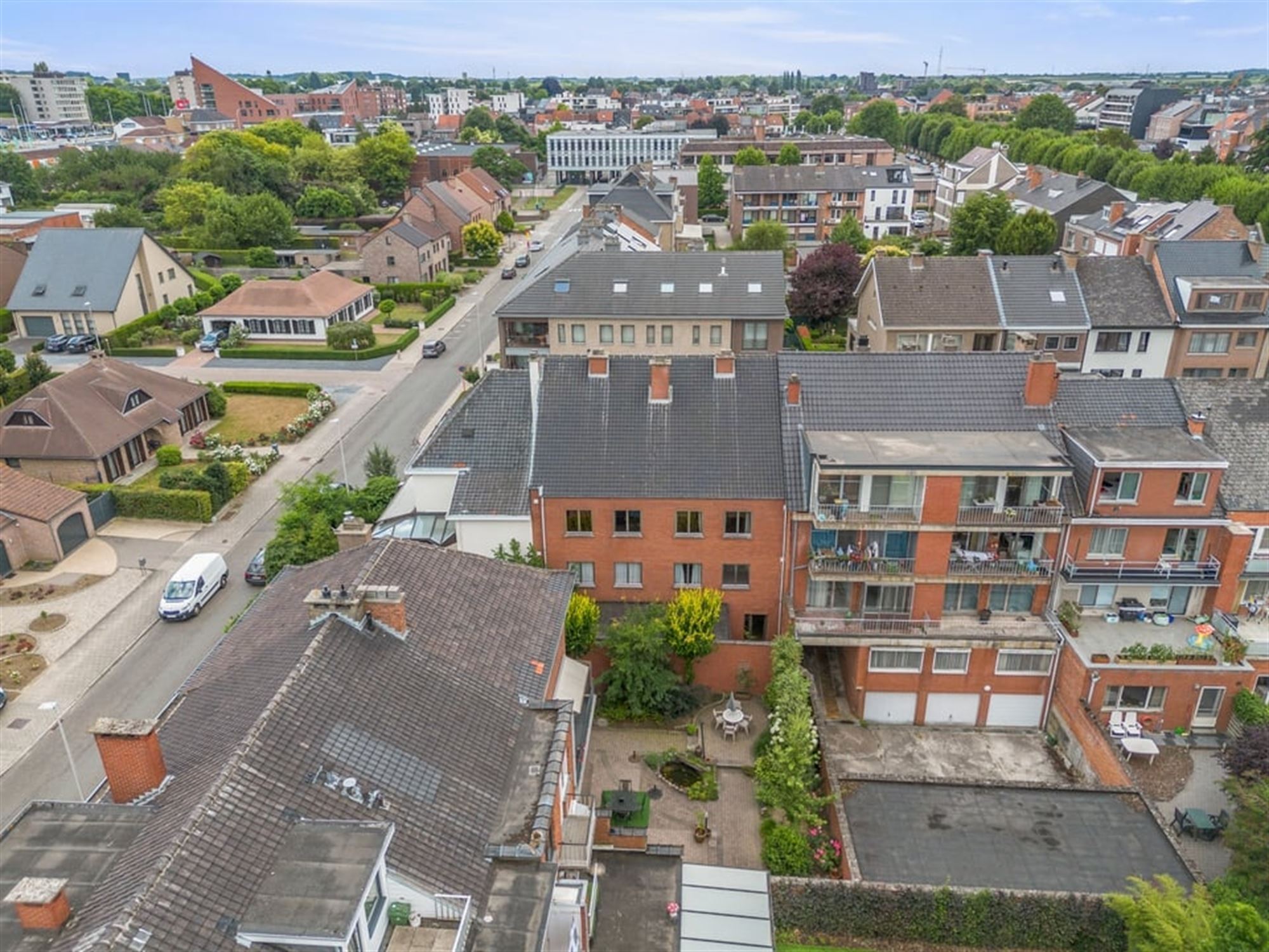 OPBRENGSTEIGENDOM MET 6 APPARTEMENTEN EN 4 STAANPLAATSEN IN SINT-TRUIDEN  foto 5