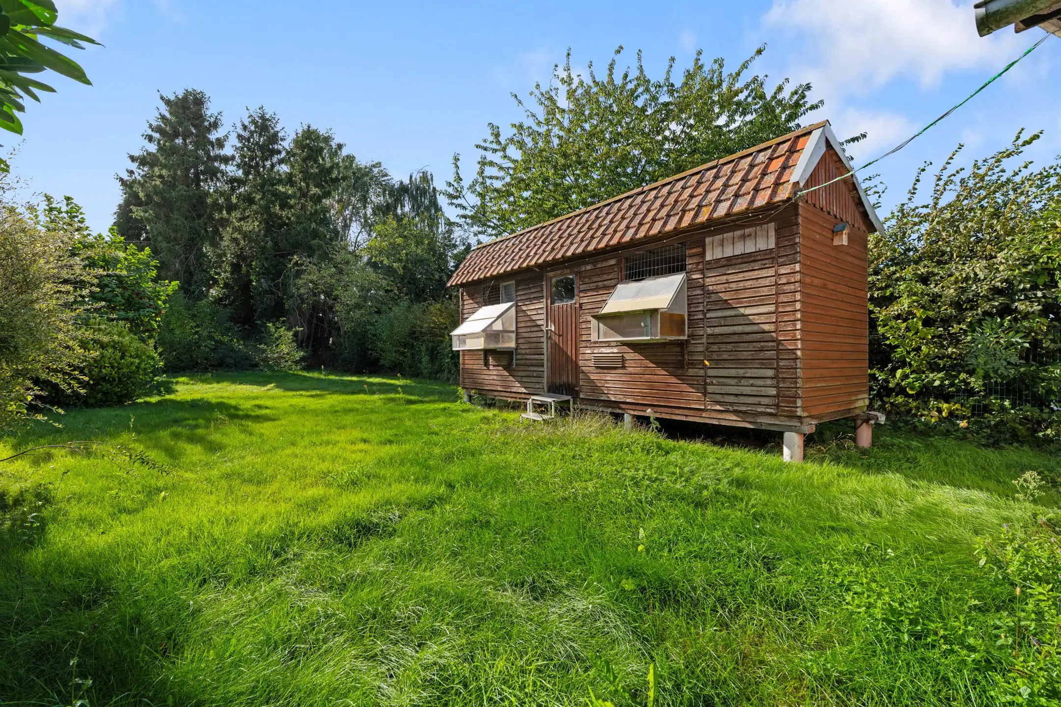 Charmante 3-gevelwoning met garage en tuin foto 27