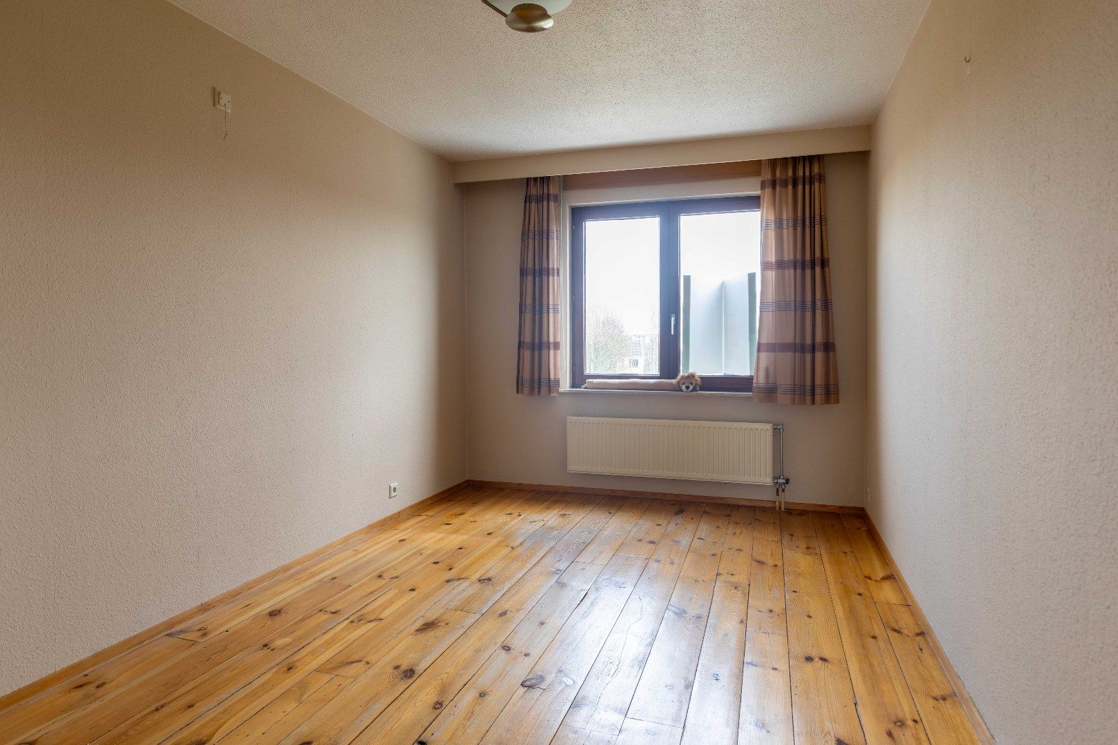 Ruim appartement met zonneterras, twee slaapkamers en gemeenschappelijke tuin in de aller beste buurt: Kristus-Koning! foto 9