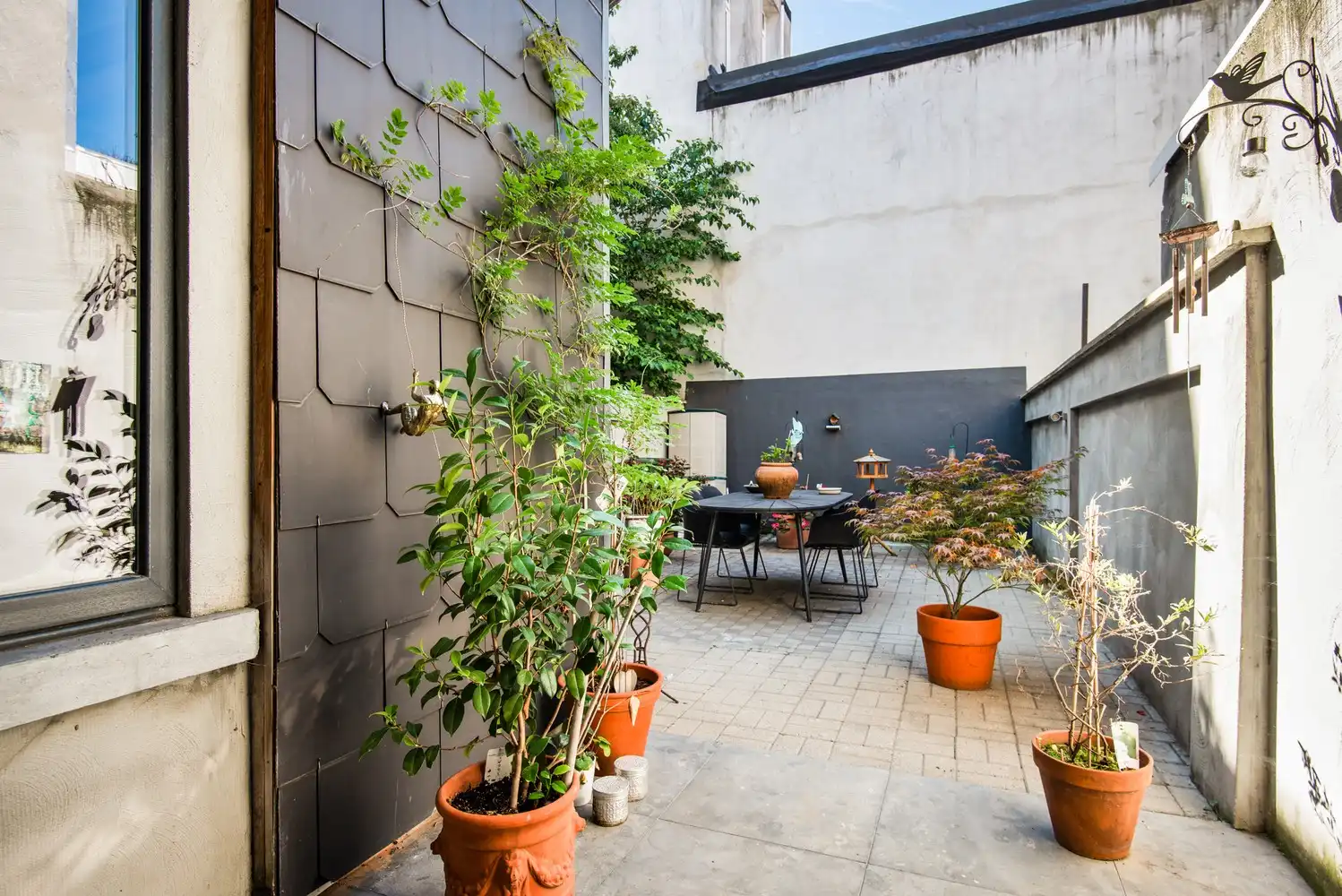 Instapklare woning met gezellige stadstuin foto 13