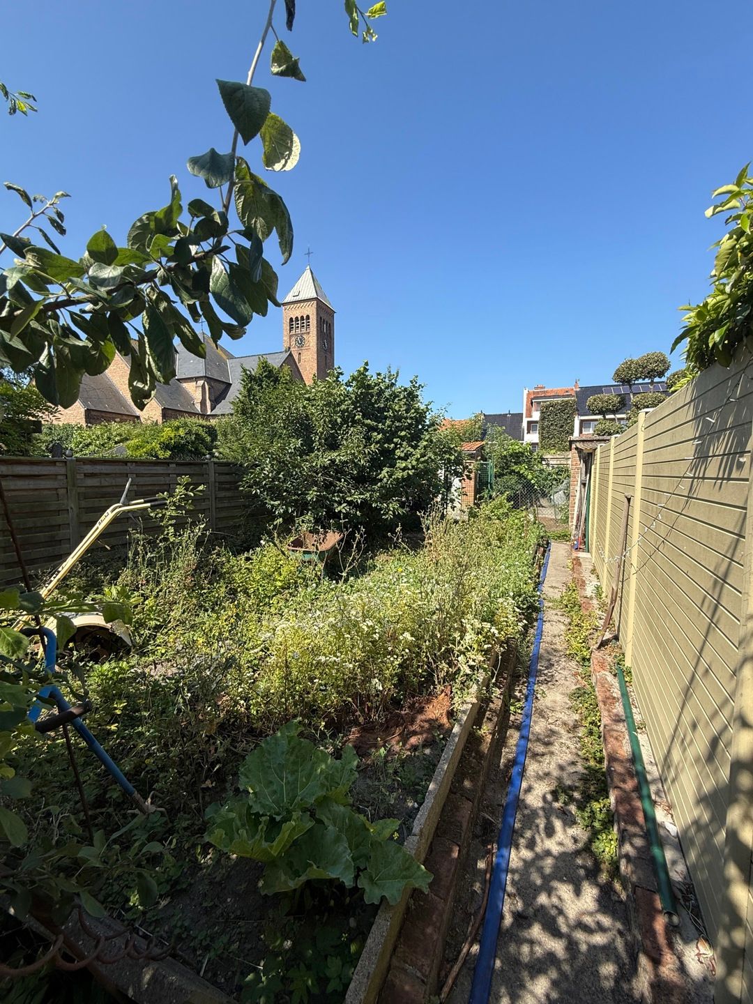Rijwoning + ZW-gerichte Tuin (nieuw dak, ramen+zonnepanelen) foto 3